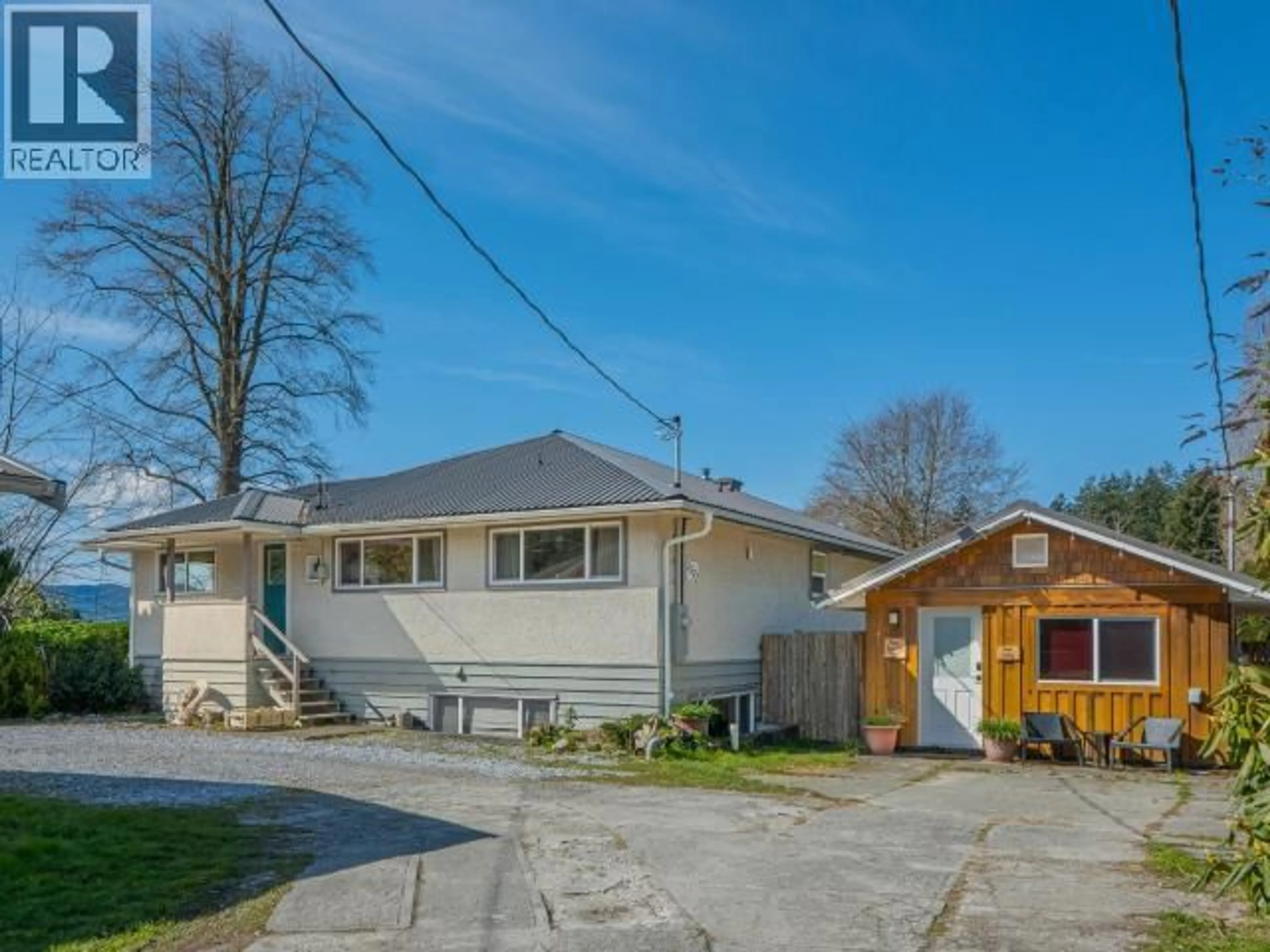A pic from outside/outdoor area/front of a property/back of a property/a pic from drone, street for 2277 PHILLIPS ROAD, Powell River British Columbia