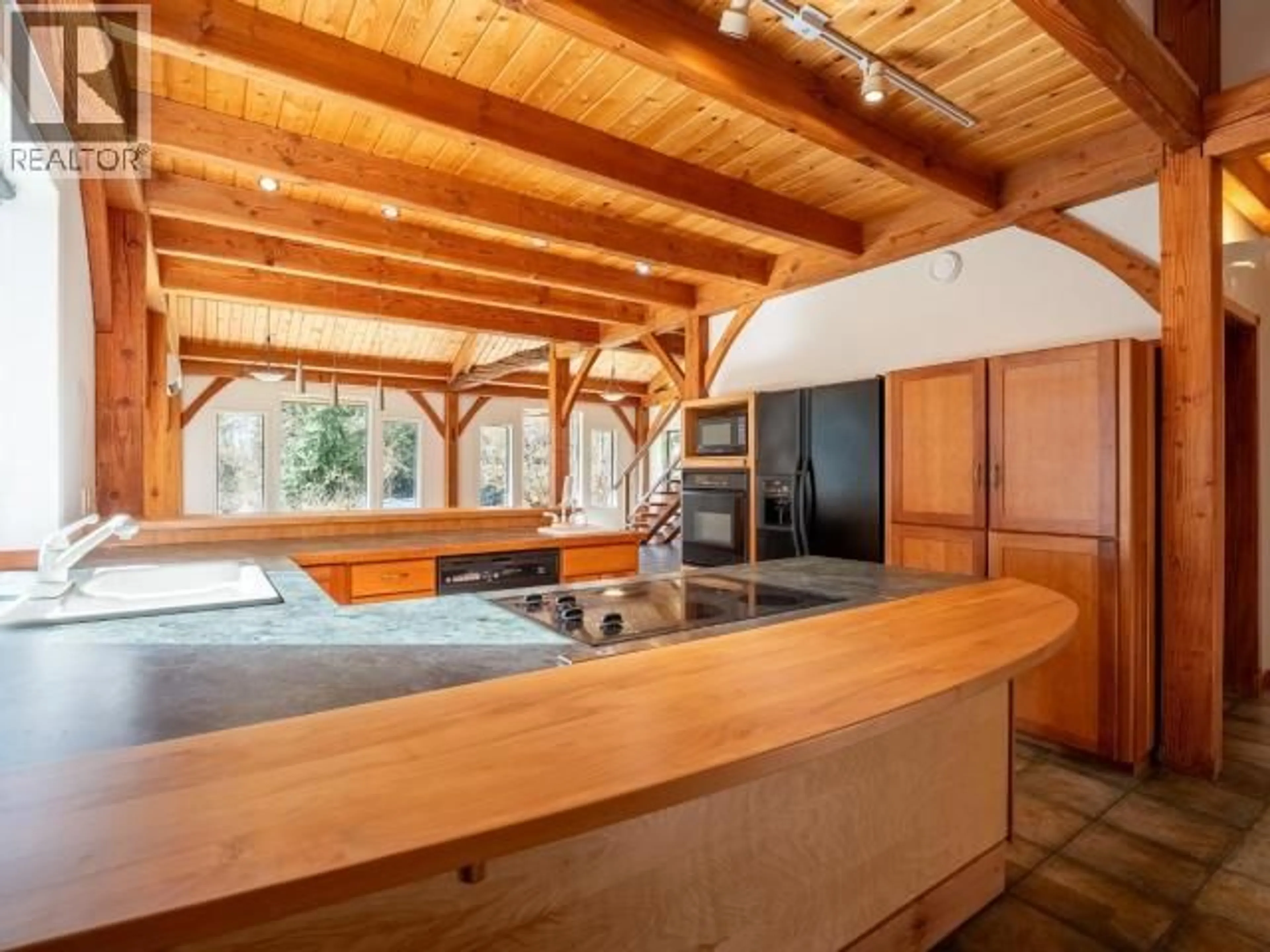 Open concept kitchen, wood/laminate floor for 7615 SOUTHVIEW ROAD, Powell River British Columbia V8A0C9