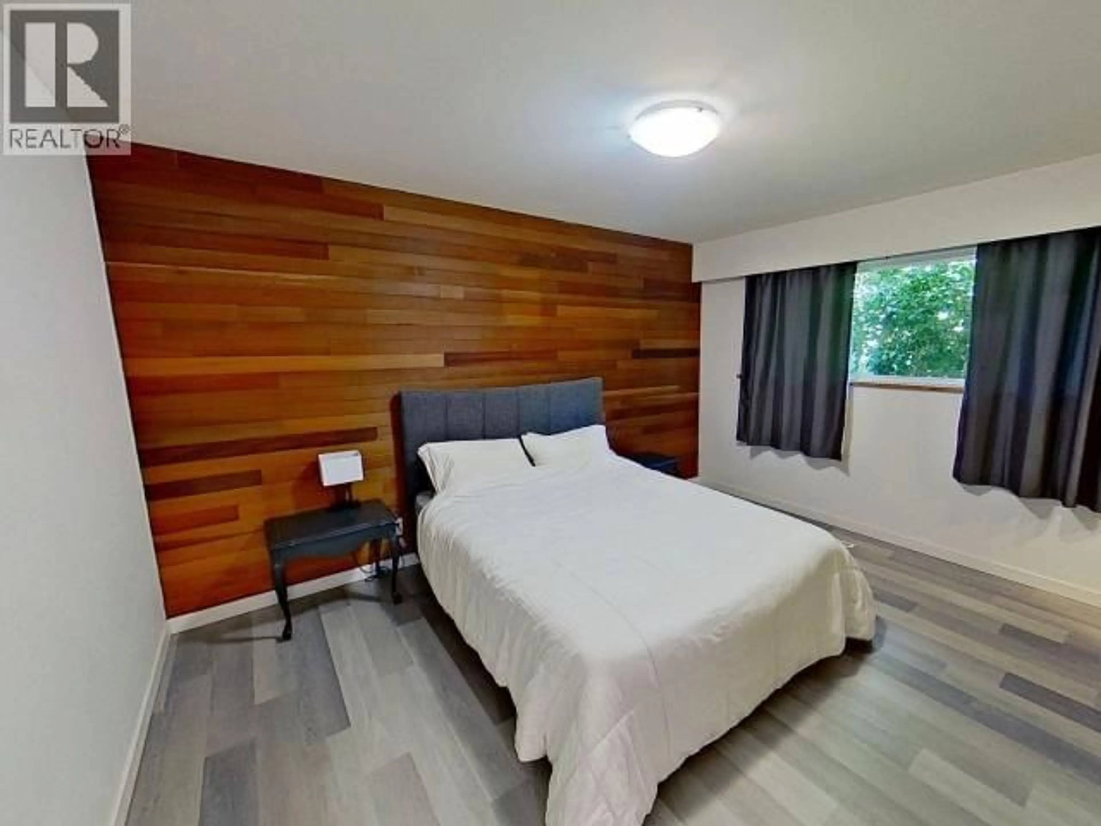 Bedroom with bed, wood/laminate floor for 12259 SCOTCH FIR POINT ROAD, Powell River British Columbia V8A0M5