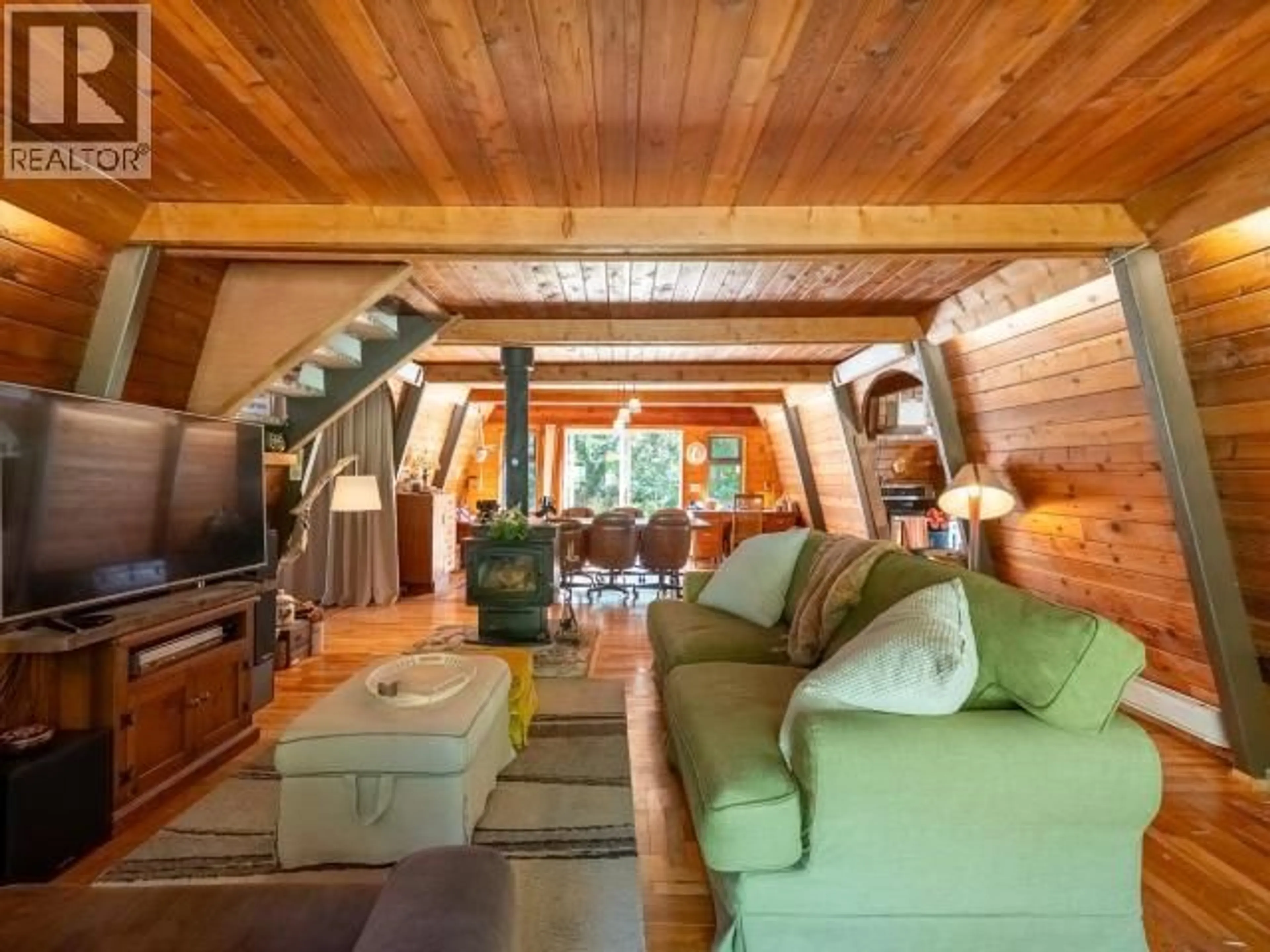 Living room with furniture, wood/laminate floor for 5029 PAXTON ROAD, Texada Island British Columbia V0N3K0
