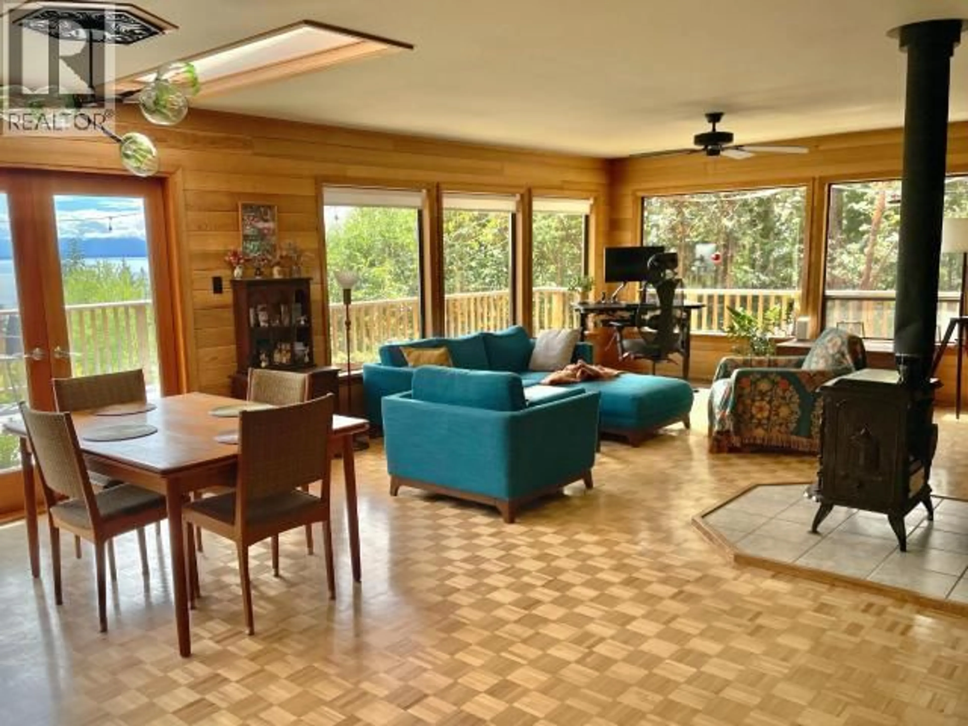 Living room with furniture, wood/laminate floor for 4108 HIGHWAY 101, Powell River British Columbia V8A0C7