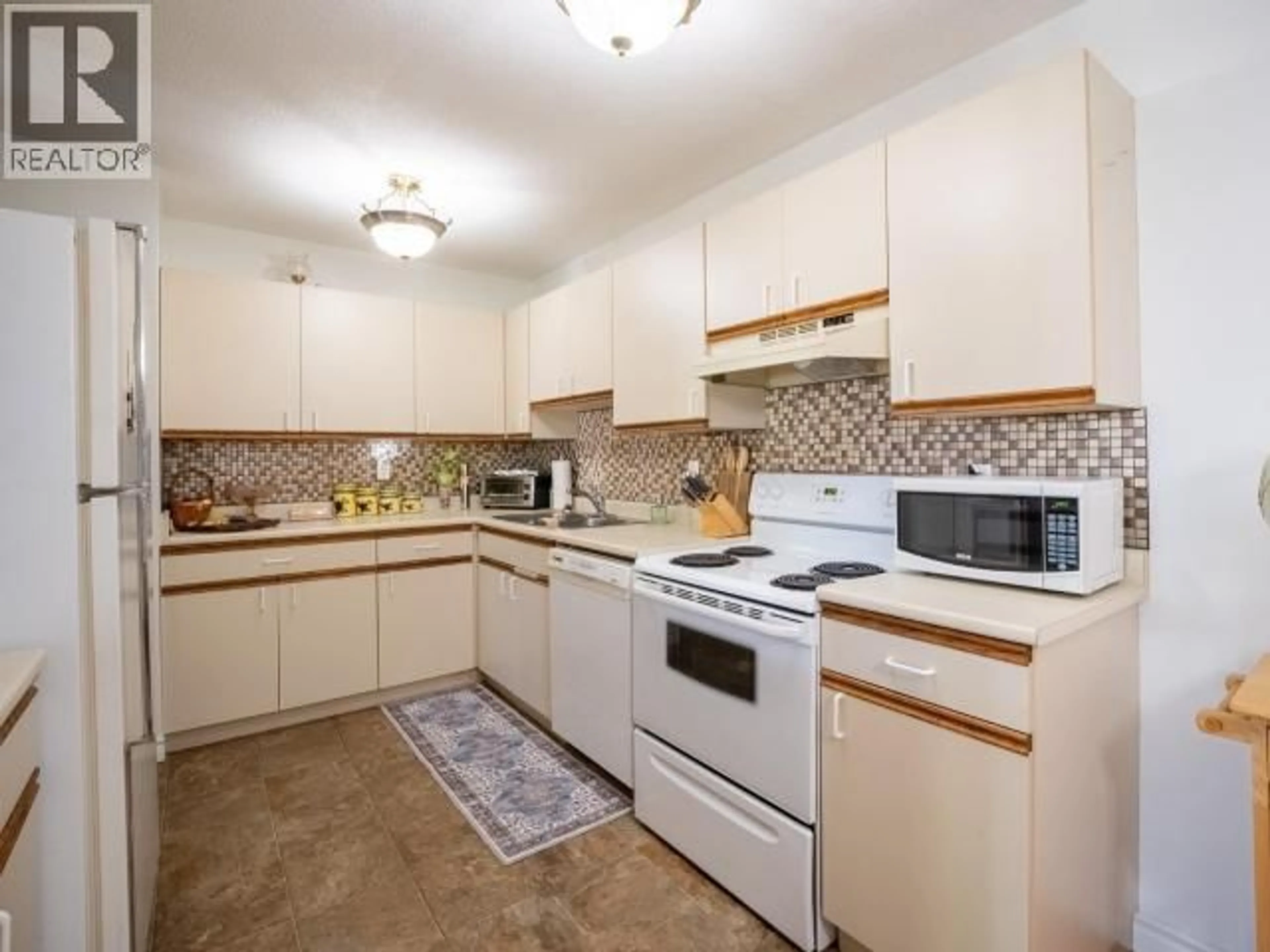 Standard kitchen, ceramic/tile floor for 103 - 4477 MICHIGAN AVE, Powell River British Columbia V8A2S4