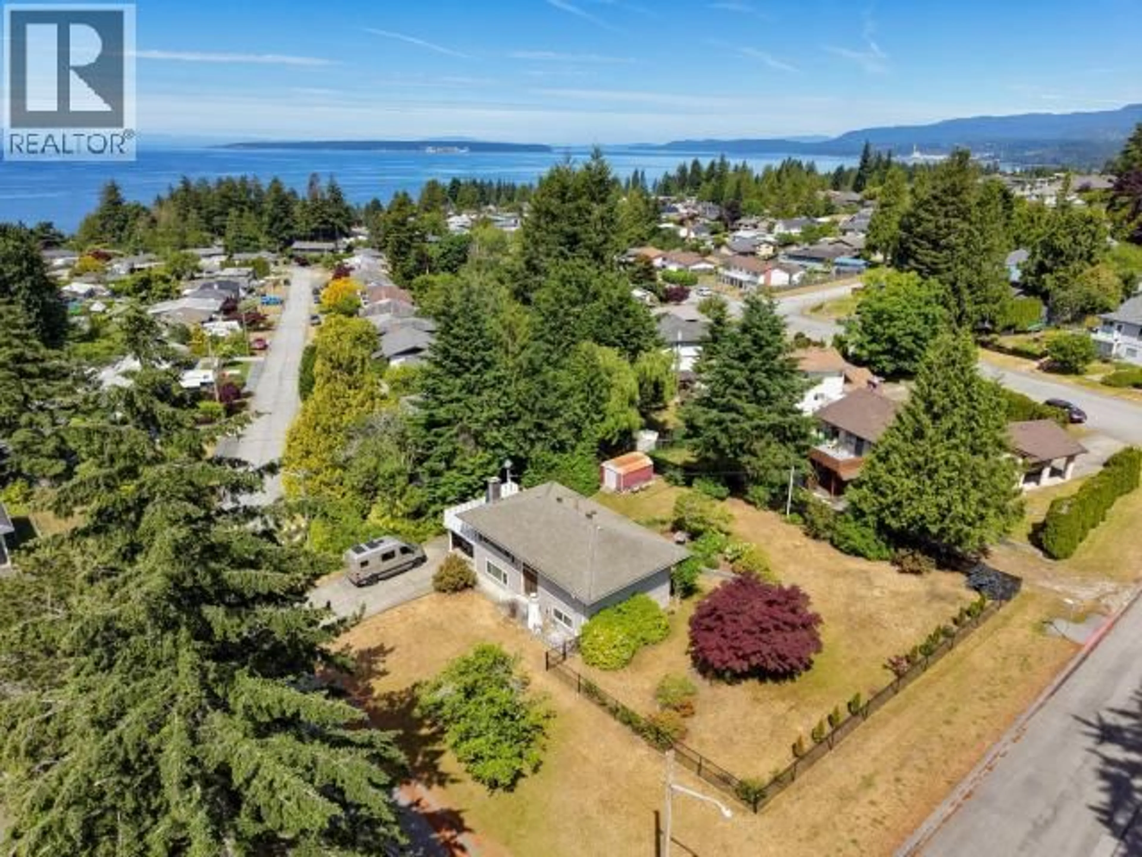 A pic from outside/outdoor area/front of a property/back of a property/a pic from drone, water/lake/river/ocean view for 7117 TAHSIS STREET, Powell River British Columbia