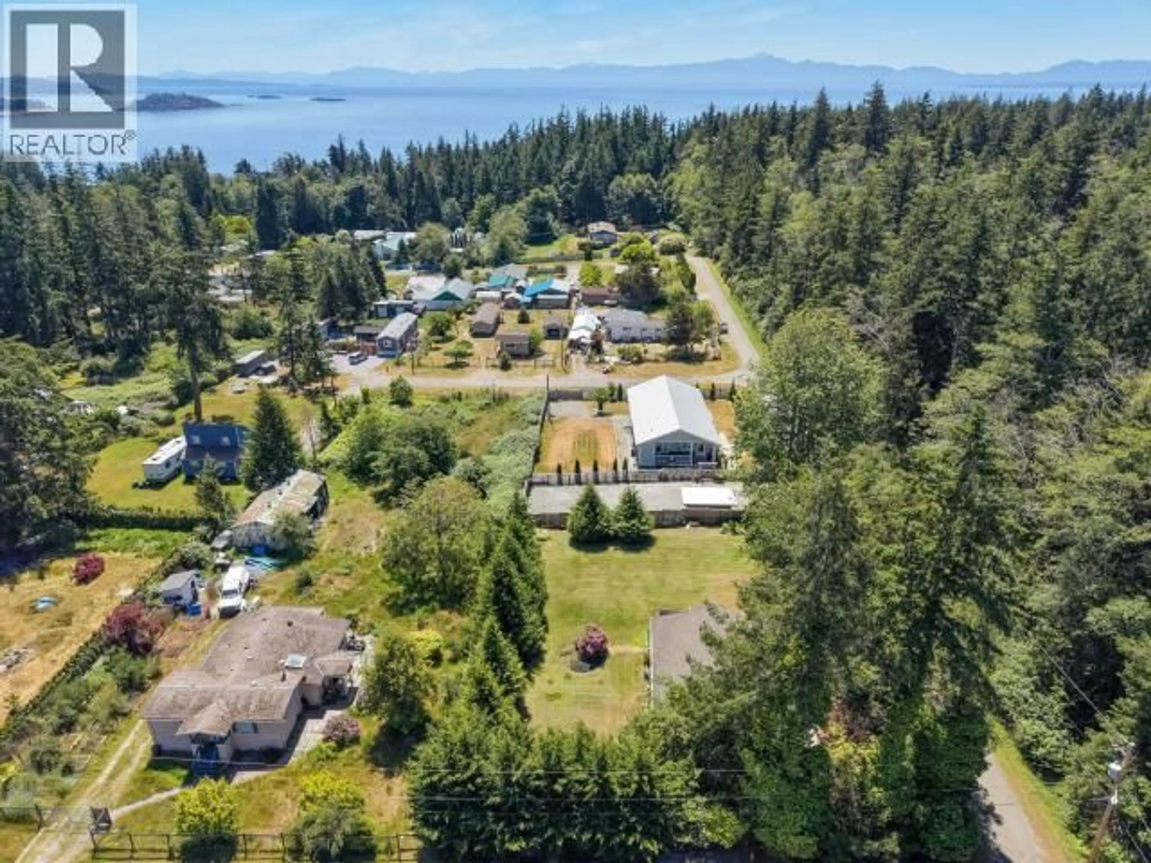 A pic from outside/outdoor area/front of a property/back of a property/a pic from drone, water/lake/river/ocean view for 3010 OAK STREET, Texada Island British Columbia
