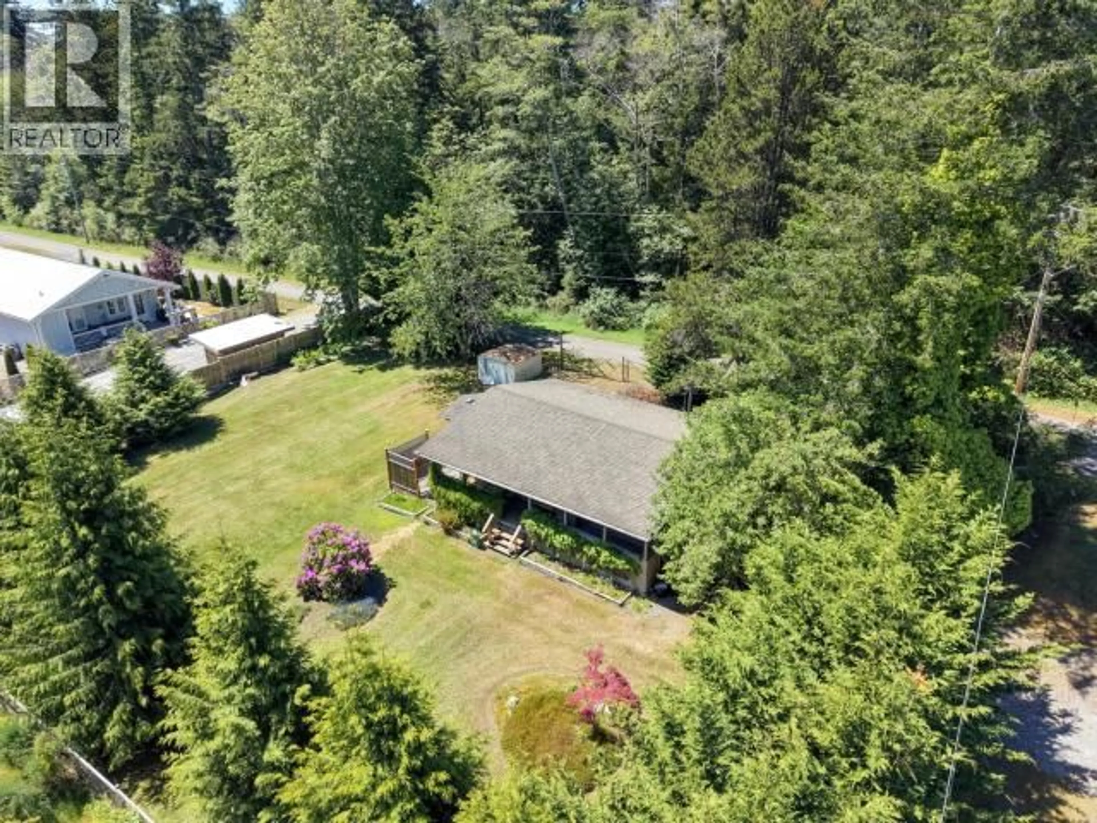 A pic from outside/outdoor area/front of a property/back of a property/a pic from drone, forest/trees view for 3010 OAK STREET, Texada Island British Columbia