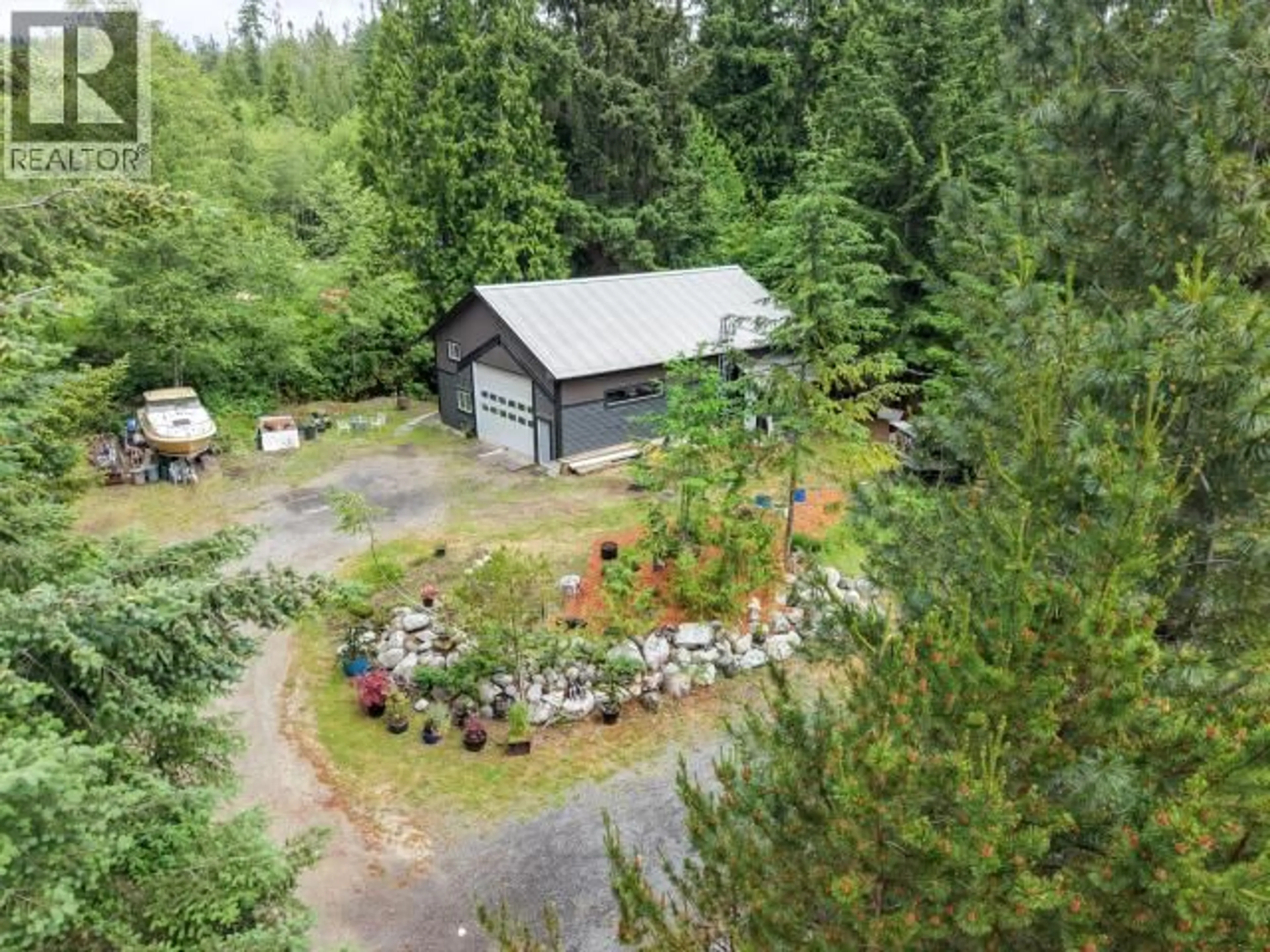 A pic from outside/outdoor area/front of a property/back of a property/a pic from drone, forest/trees view for 11198 TUCK ROAD, Powell River British Columbia