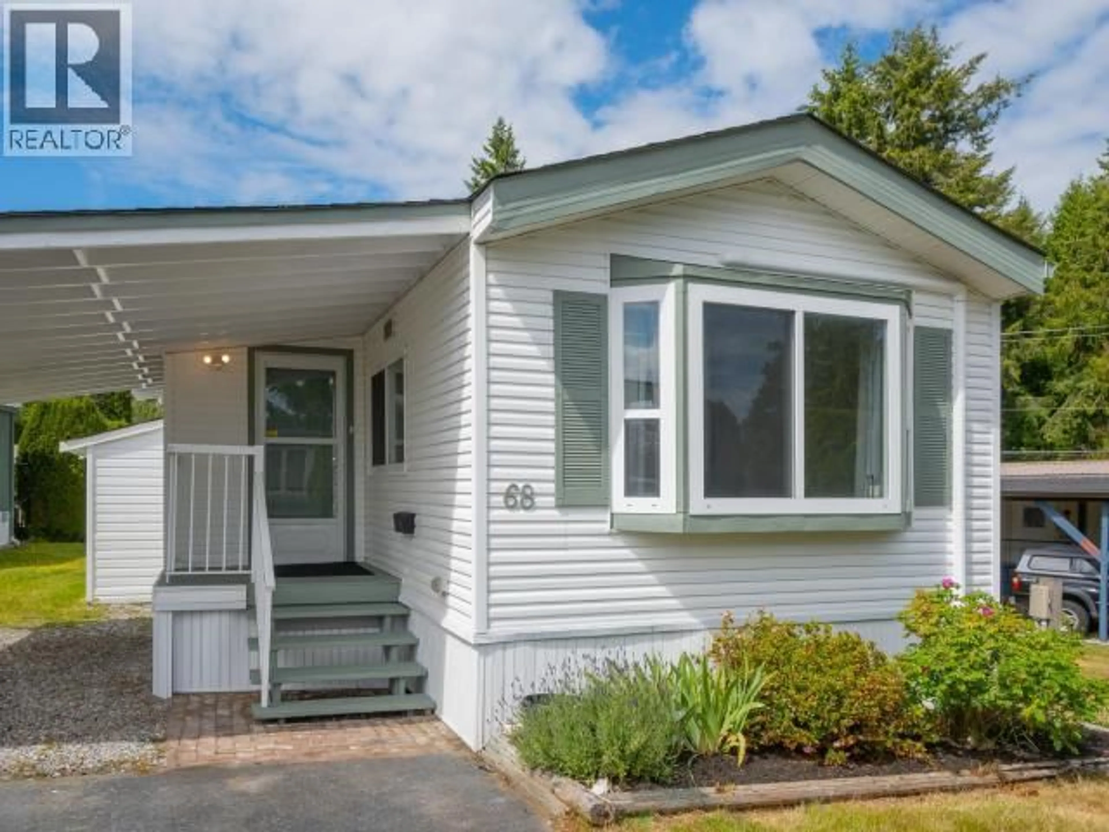 Home with vinyl exterior material, street for 68-7624 DUNCAN STREET, Powell River British Columbia V8A5L2