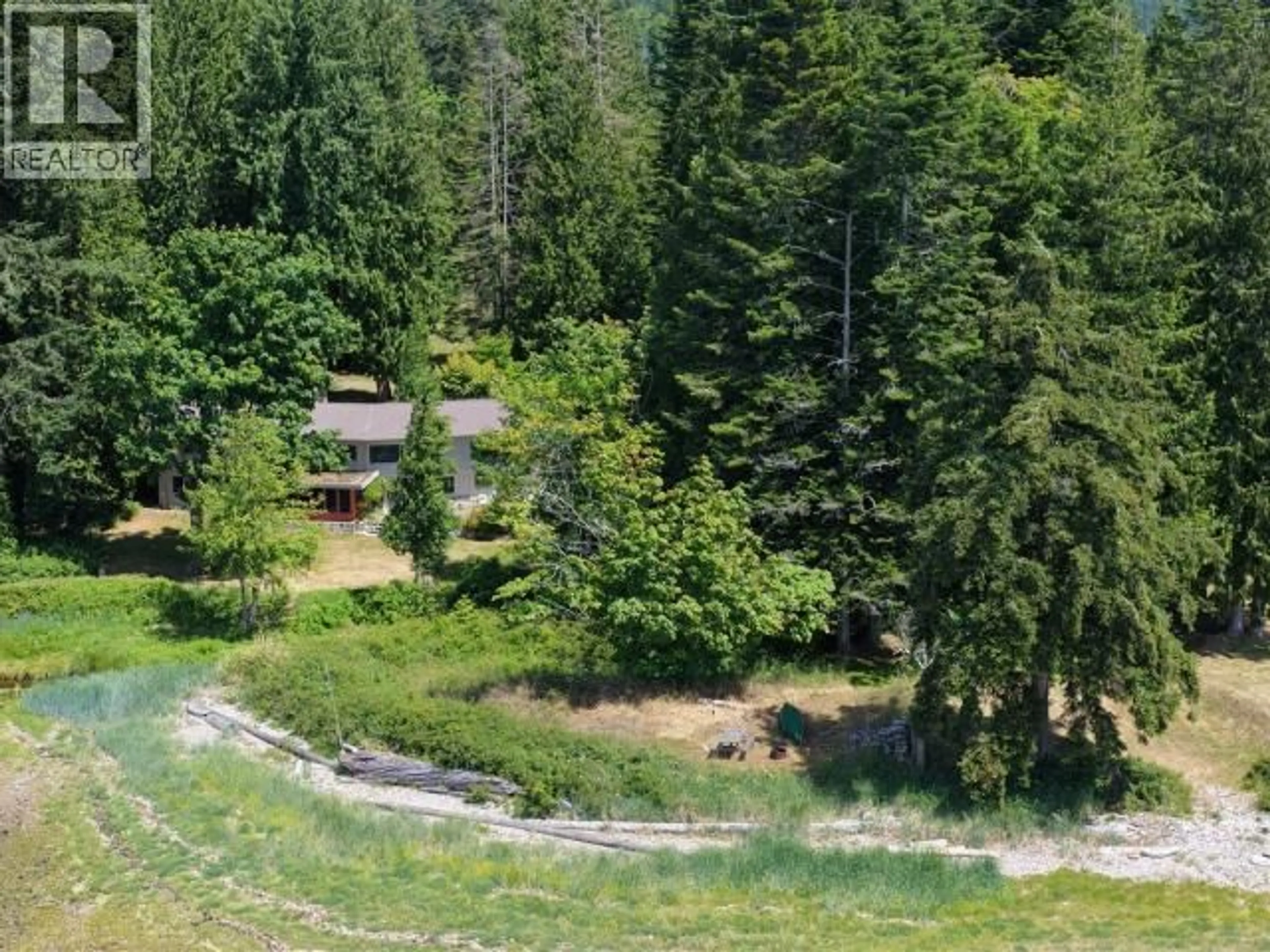 A pic from outside/outdoor area/front of a property/back of a property/a pic from drone, forest/trees view for 7987 TRAFFE RD, Powell River British Columbia V8A0R6