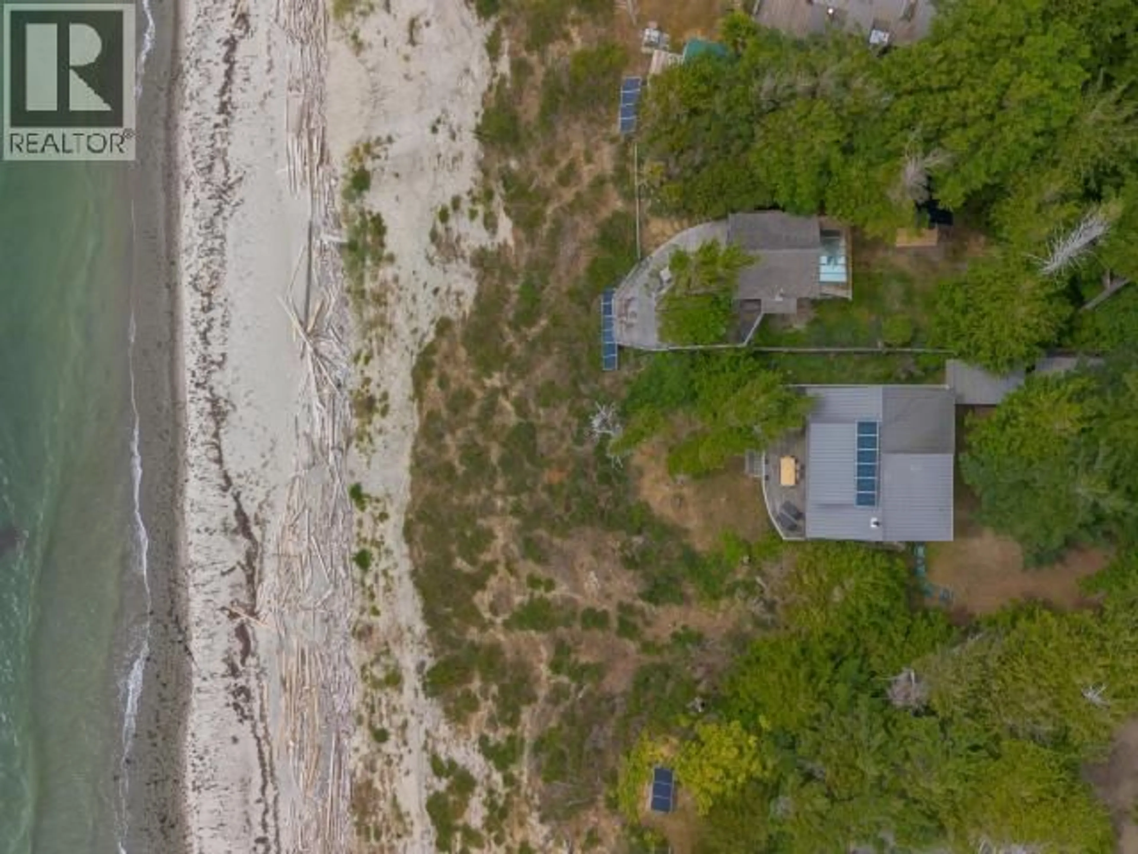 A pic from outside/outdoor area/front of a property/back of a property/a pic from drone, water/lake/river/ocean view for 1772 VANCOUVER BLVD, Savary Island British Columbia V0N2G0