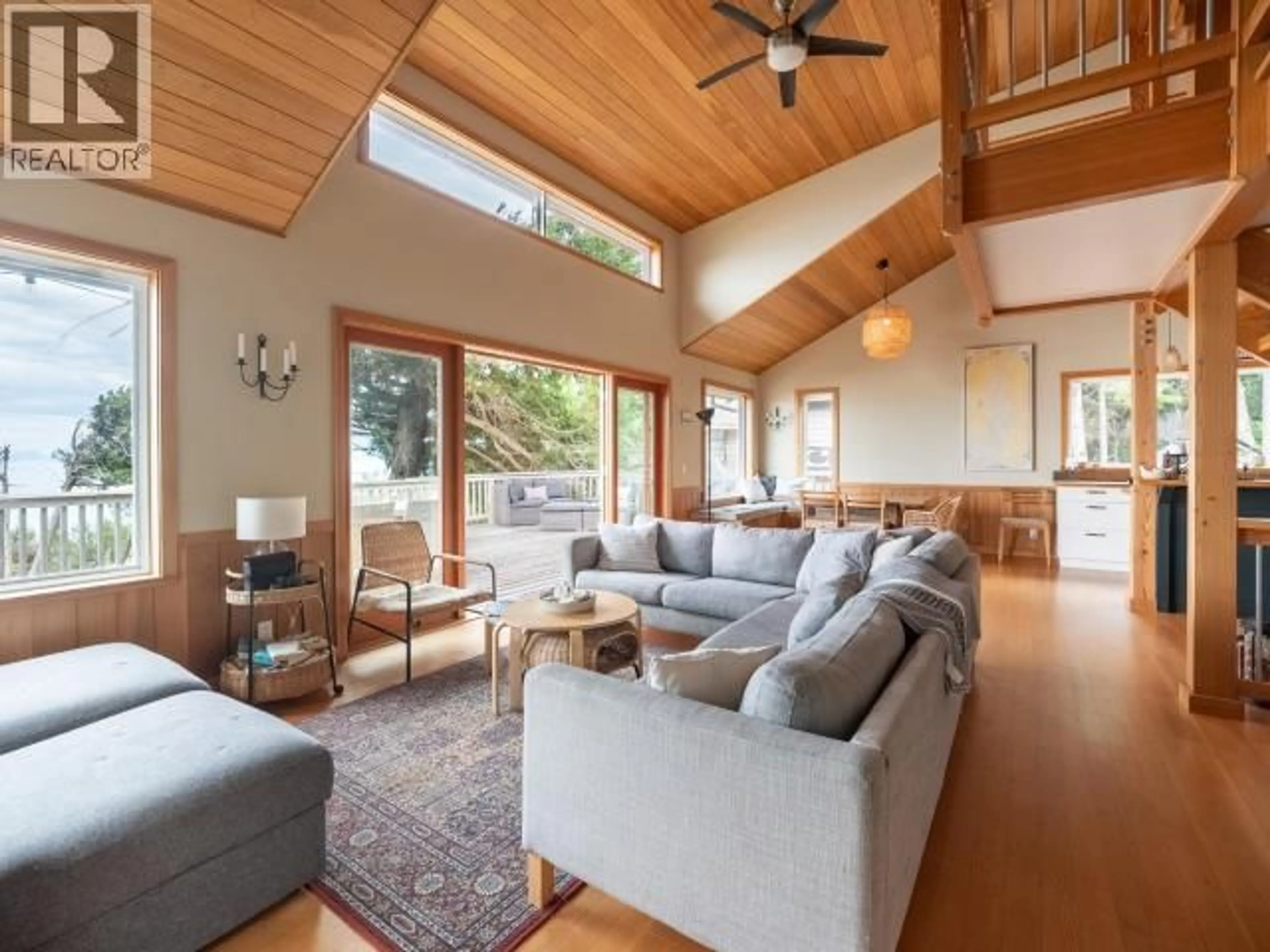Living room with furniture, wood/laminate floor for 1772 VANCOUVER BLVD, Savary Island British Columbia V0N2G0
