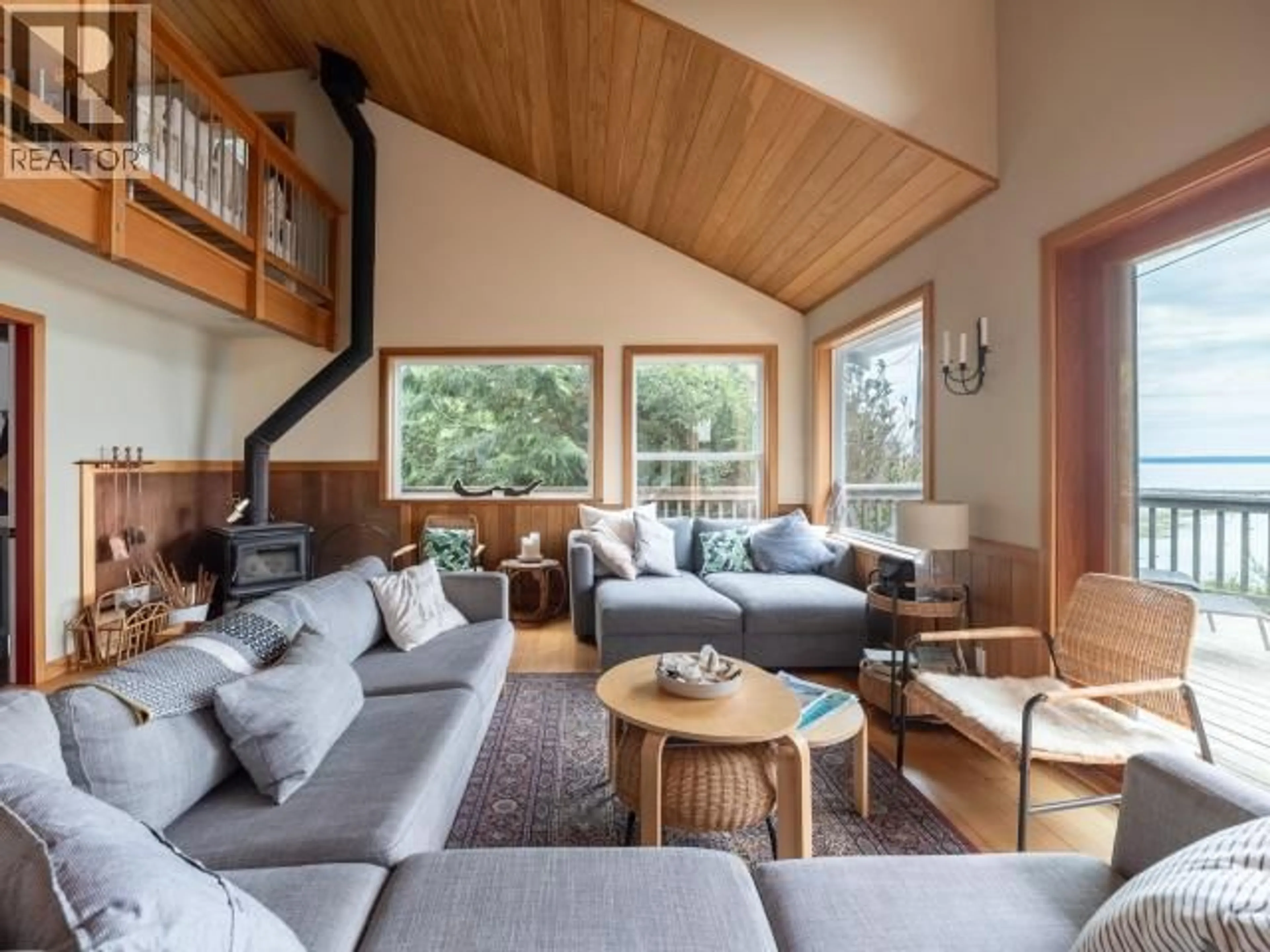 Living room with furniture, wood/laminate floor for 1772 VANCOUVER BLVD, Savary Island British Columbia V0N2G0