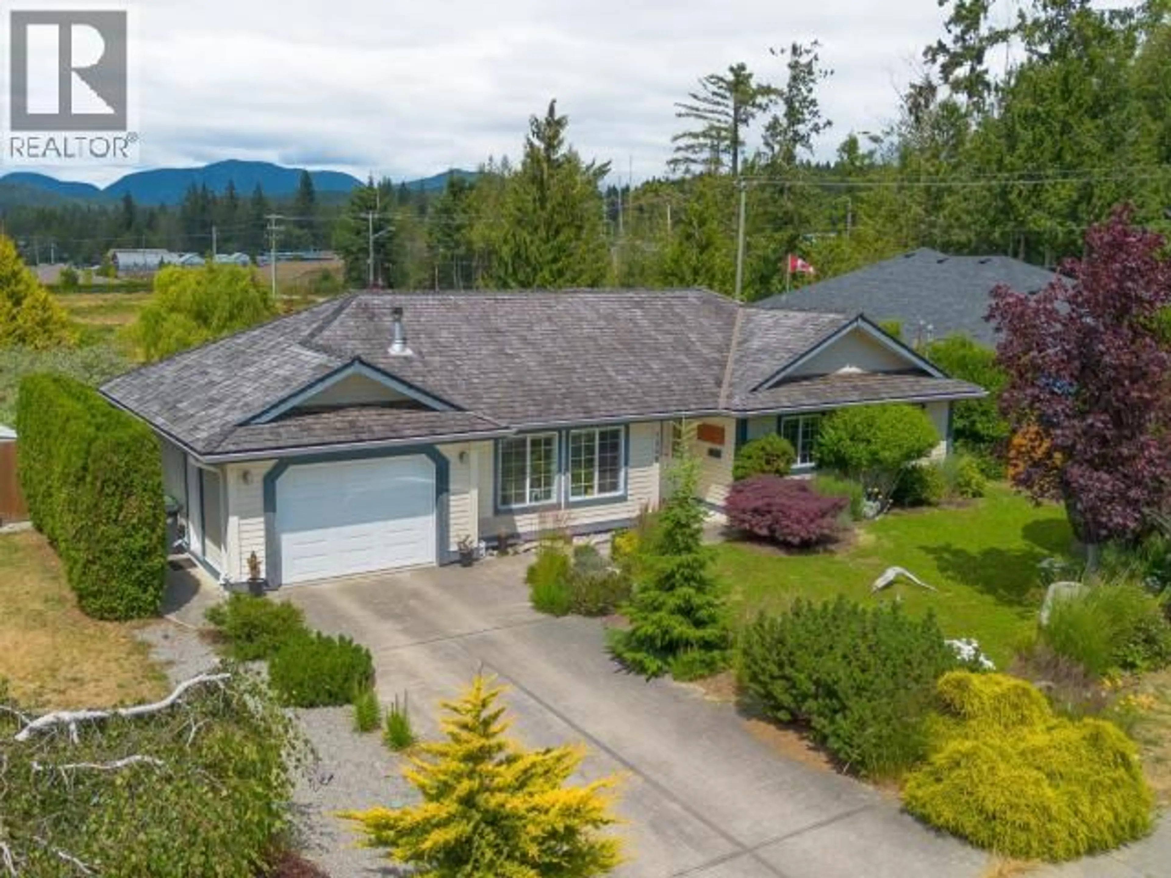 A pic from outside/outdoor area/front of a property/back of a property/a pic from drone, mountain view for 7249 FIELD STREET, Powell River British Columbia V8A5S9