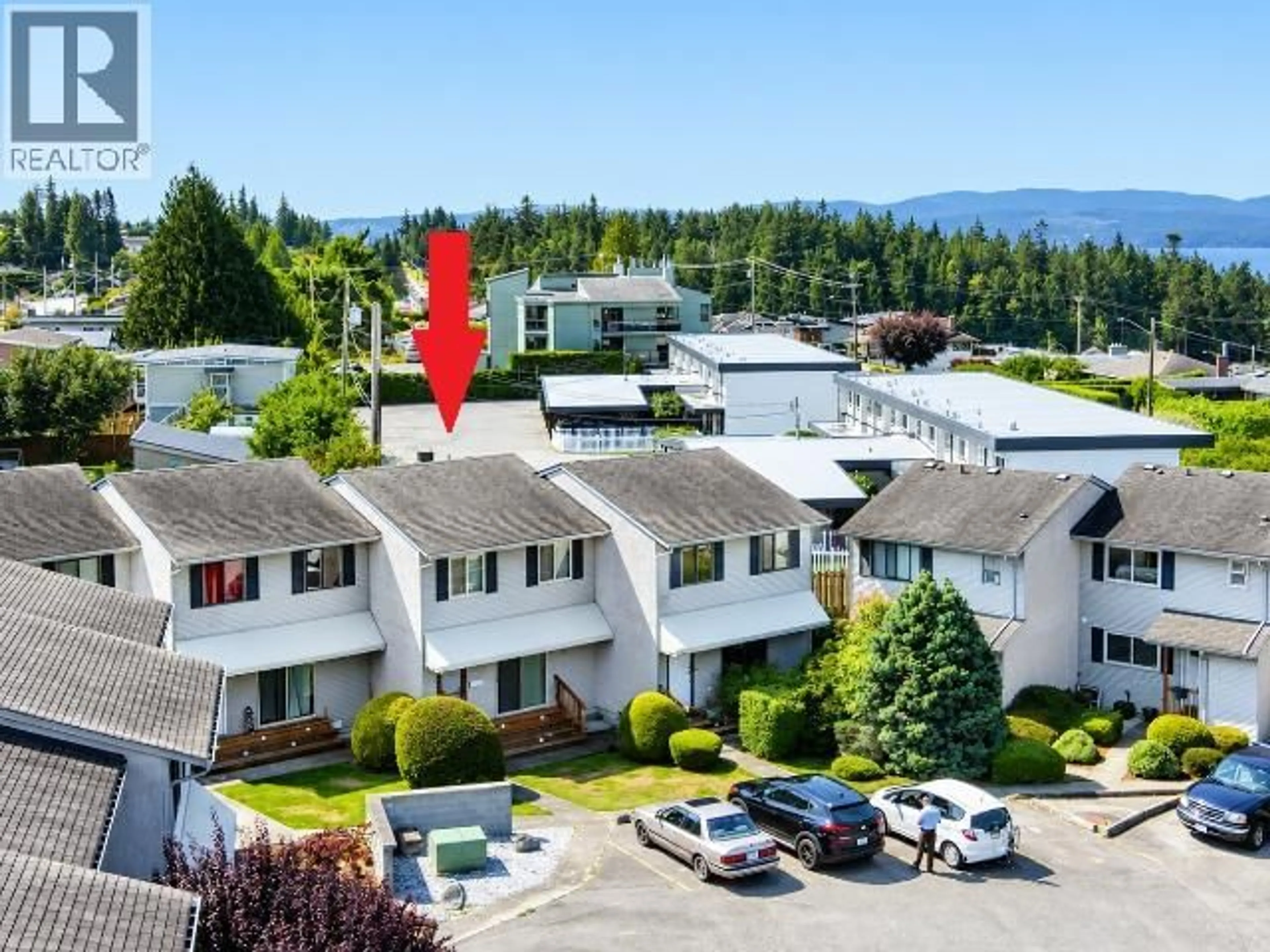 A pic from outside/outdoor area/front of a property/back of a property/a pic from drone, mountain view for 18 - 3870 JOYCE AVE, Powell River British Columbia V8A2Z1