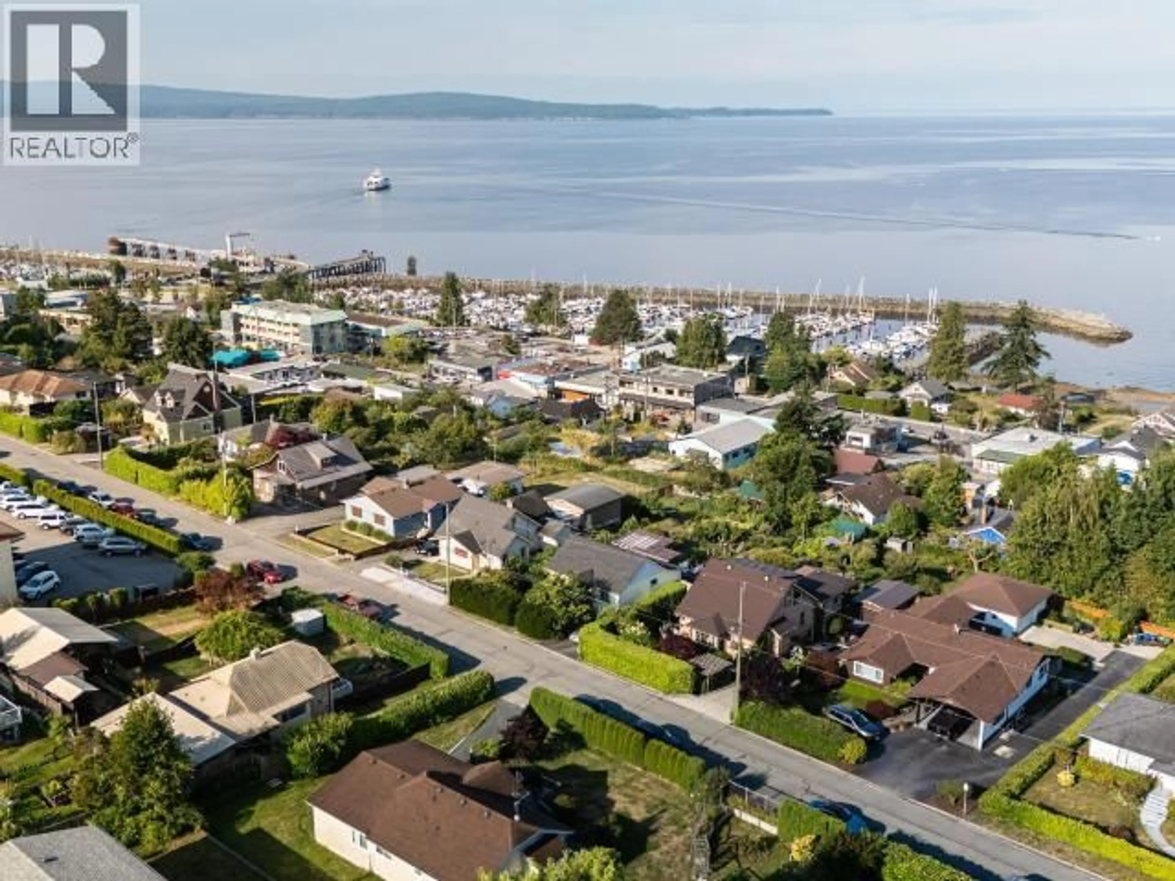A pic from outside/outdoor area/front of a property/back of a property/a pic from drone, water/lake/river/ocean view for 6892 BURNABY STREET, Powell River British Columbia