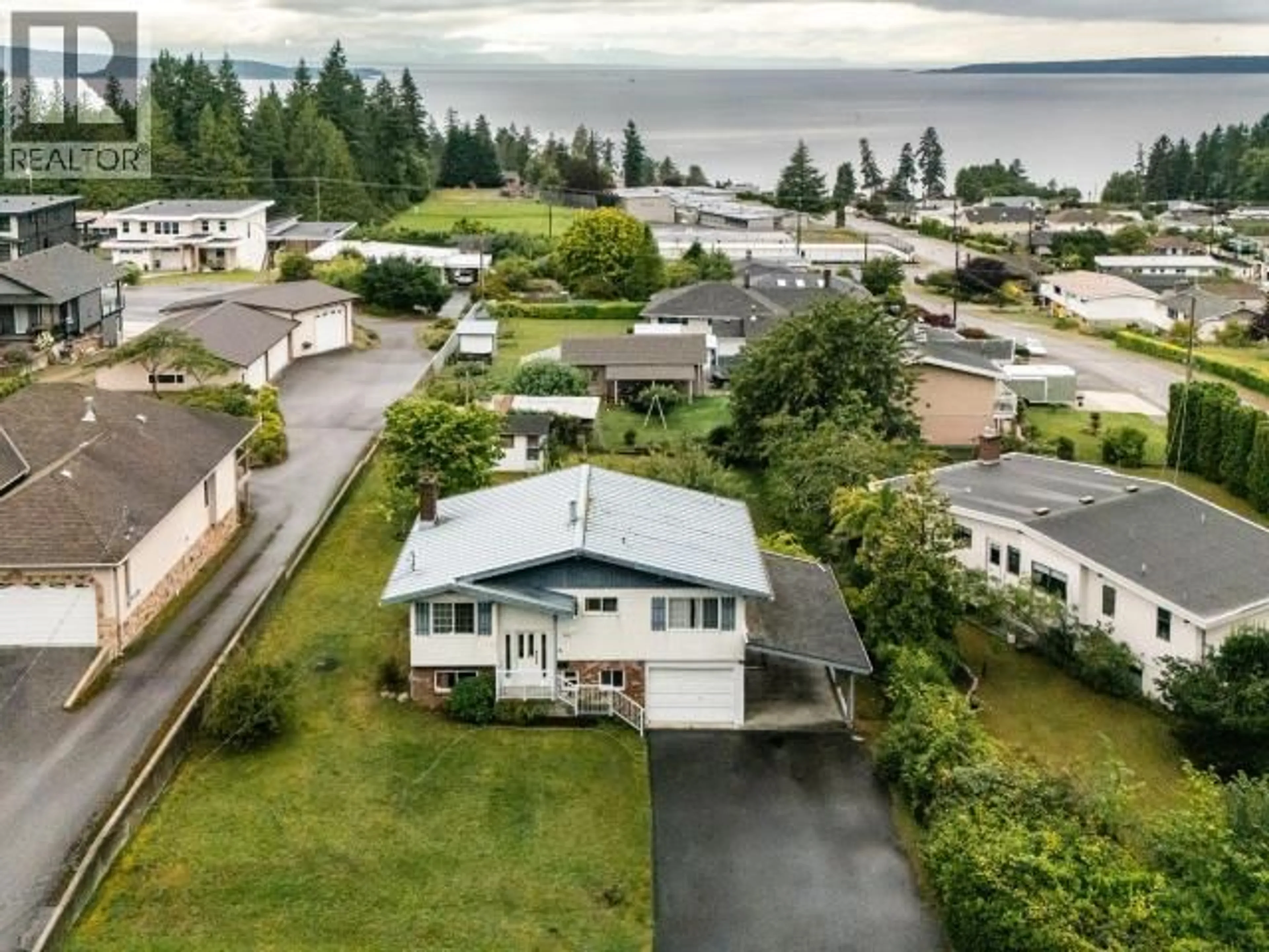 A pic from outside/outdoor area/front of a property/back of a property/a pic from drone, water/lake/river/ocean view for 3571 MACKENZIE AVE, Powell River British Columbia V8A3E7