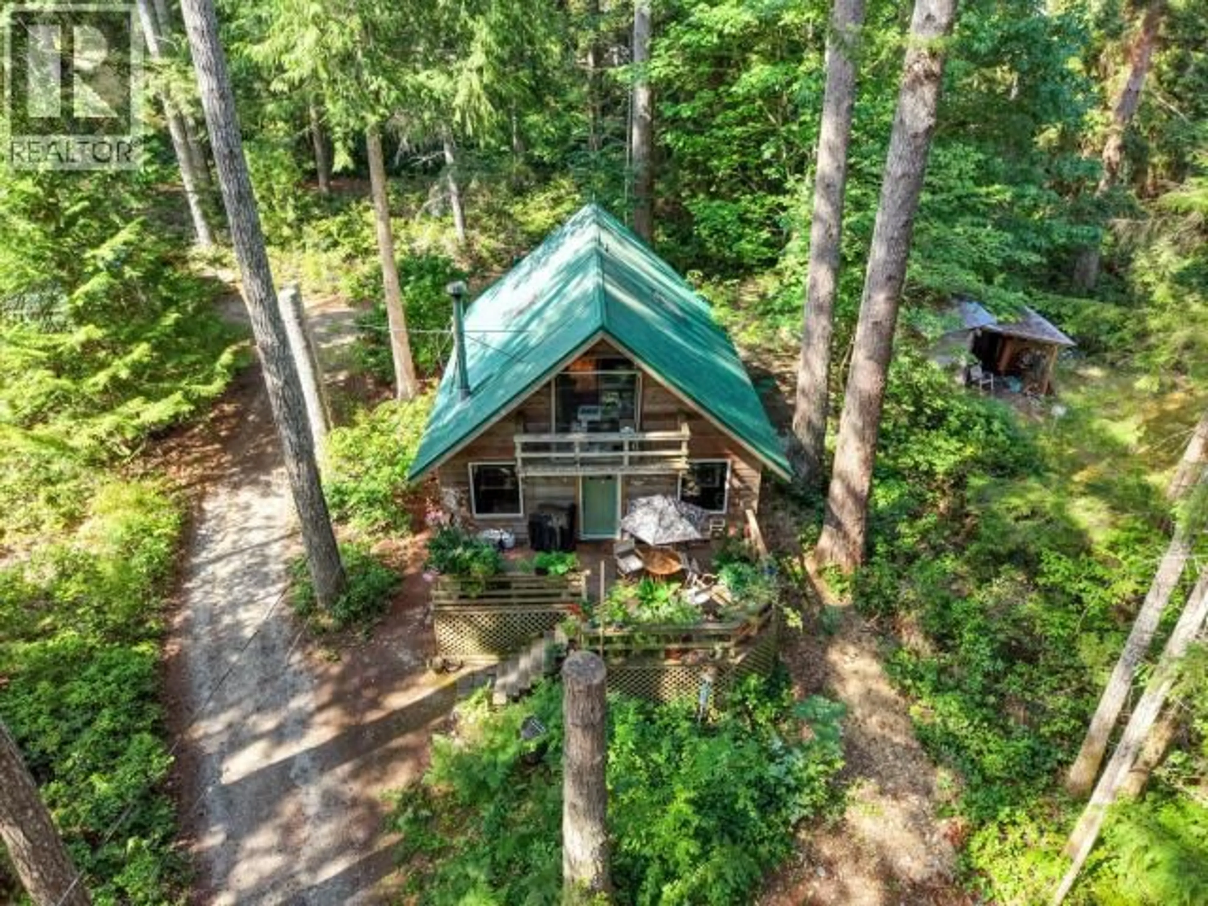 A pic from outside/outdoor area/front of a property/back of a property/a pic from drone, forest/trees view for 11214 PALM BEACH ROAD, Powell River British Columbia V8A0M1
