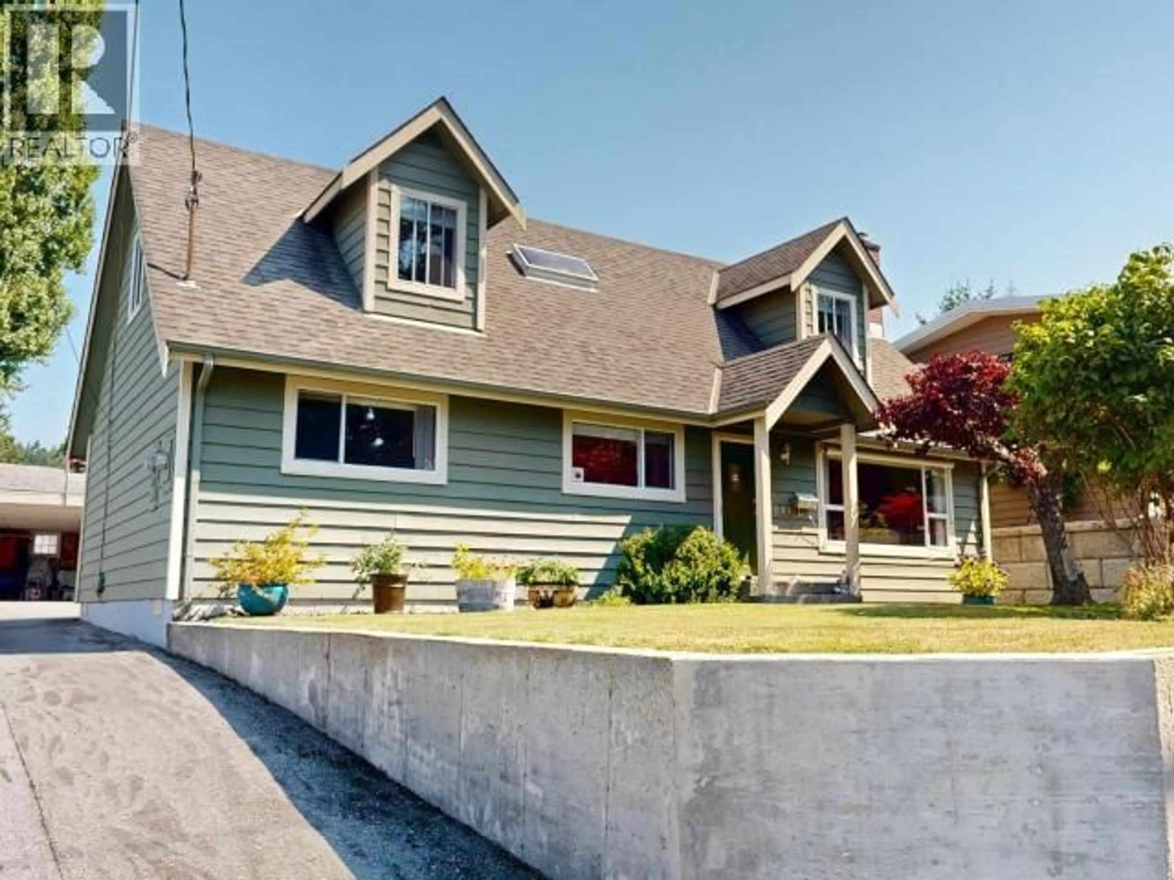 Home with vinyl exterior material, street for 7081 TOFINO STREET, Powell River British Columbia
