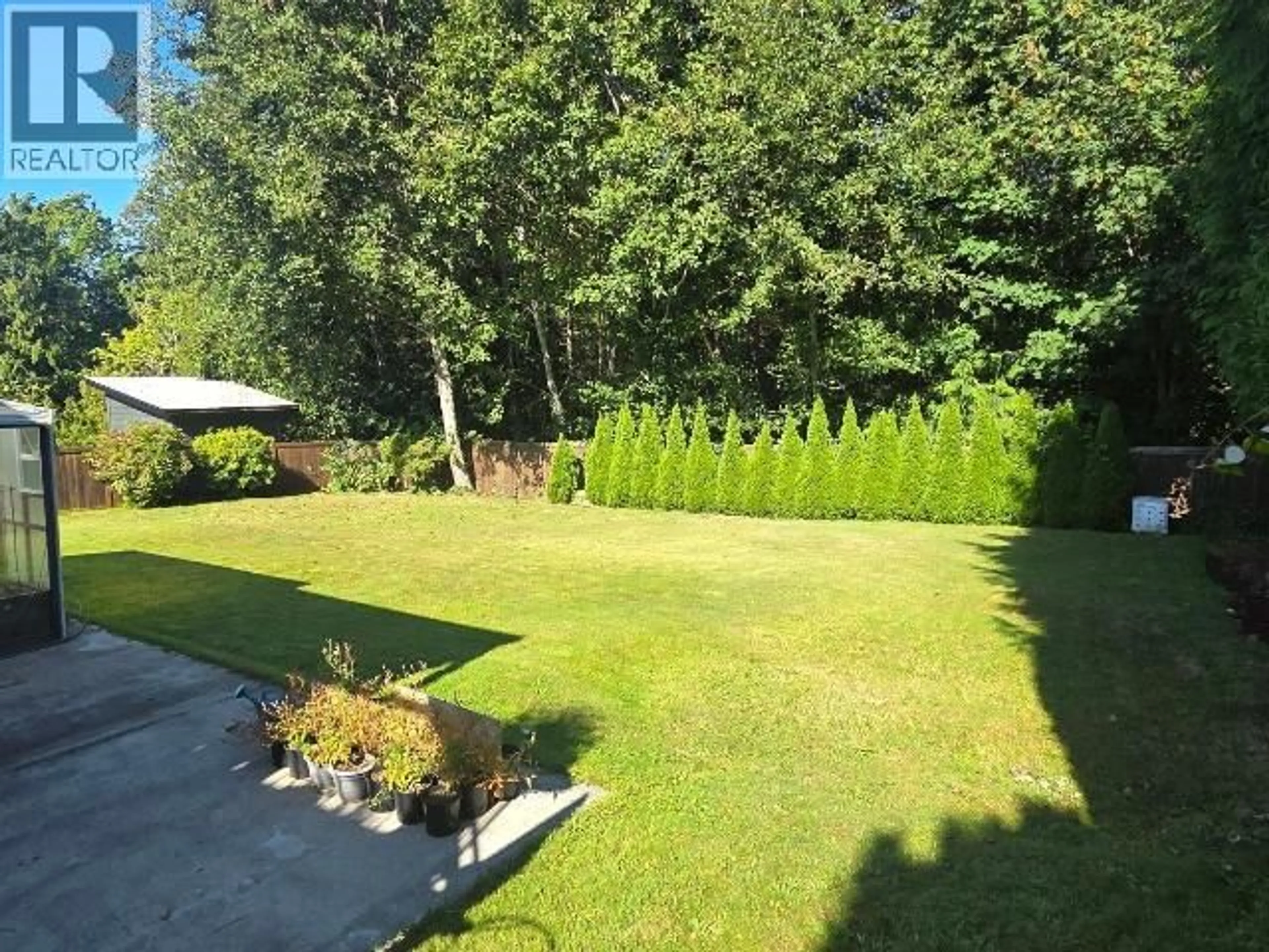 A pic from outside/outdoor area/front of a property/back of a property/a pic from drone, forest/trees view for 4865 HARVIE AVE, Powell River British Columbia V8A5R6