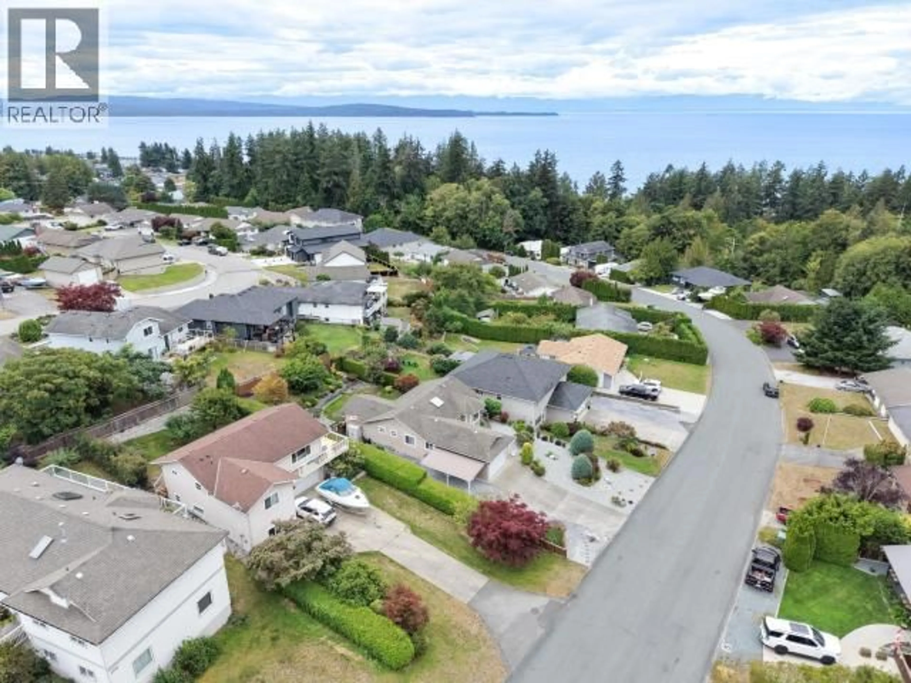 A pic from outside/outdoor area/front of a property/back of a property/a pic from drone, water/lake/river/ocean view for 6886 HARVIE AVE, Powell River British Columbia V8A5J1