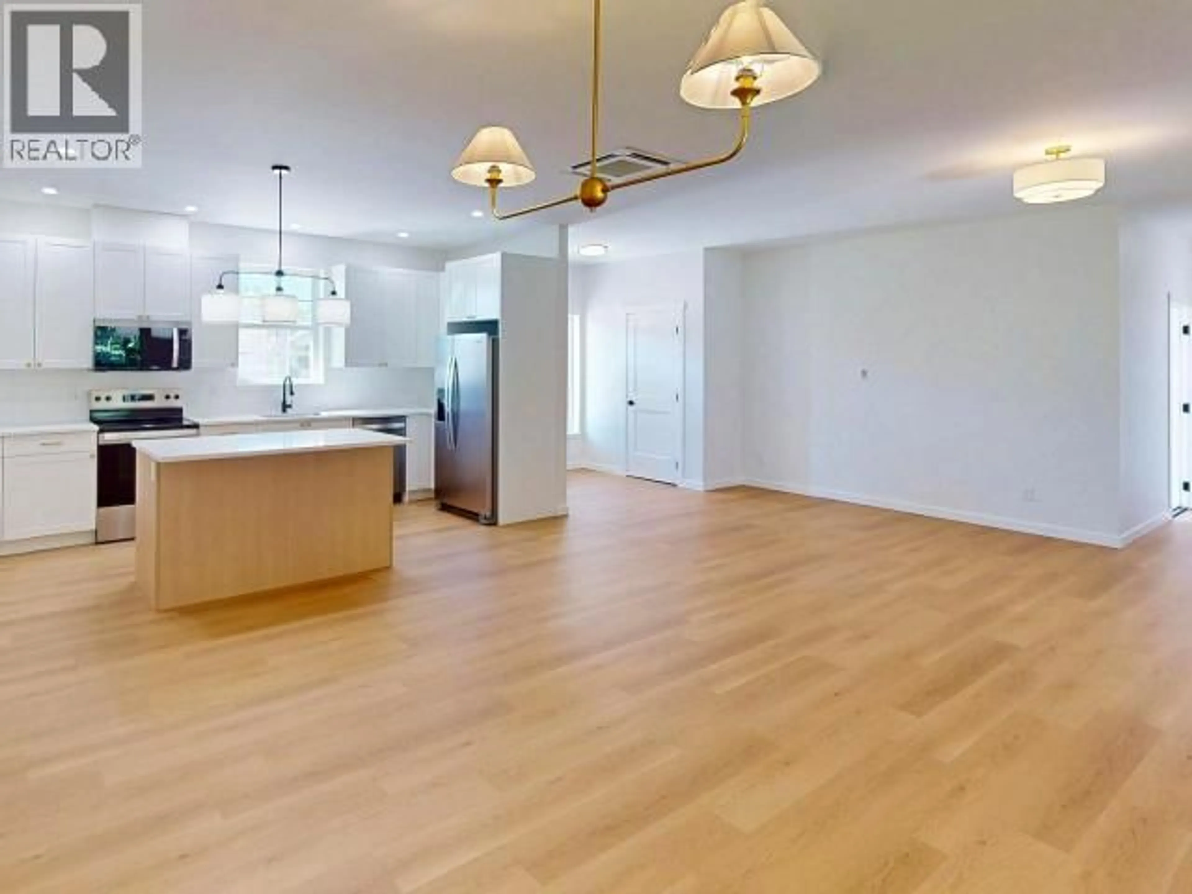 Open concept kitchen, wood/laminate floor for 107 - 7440 NOOTKA STREET, Powell River British Columbia V8A0P8