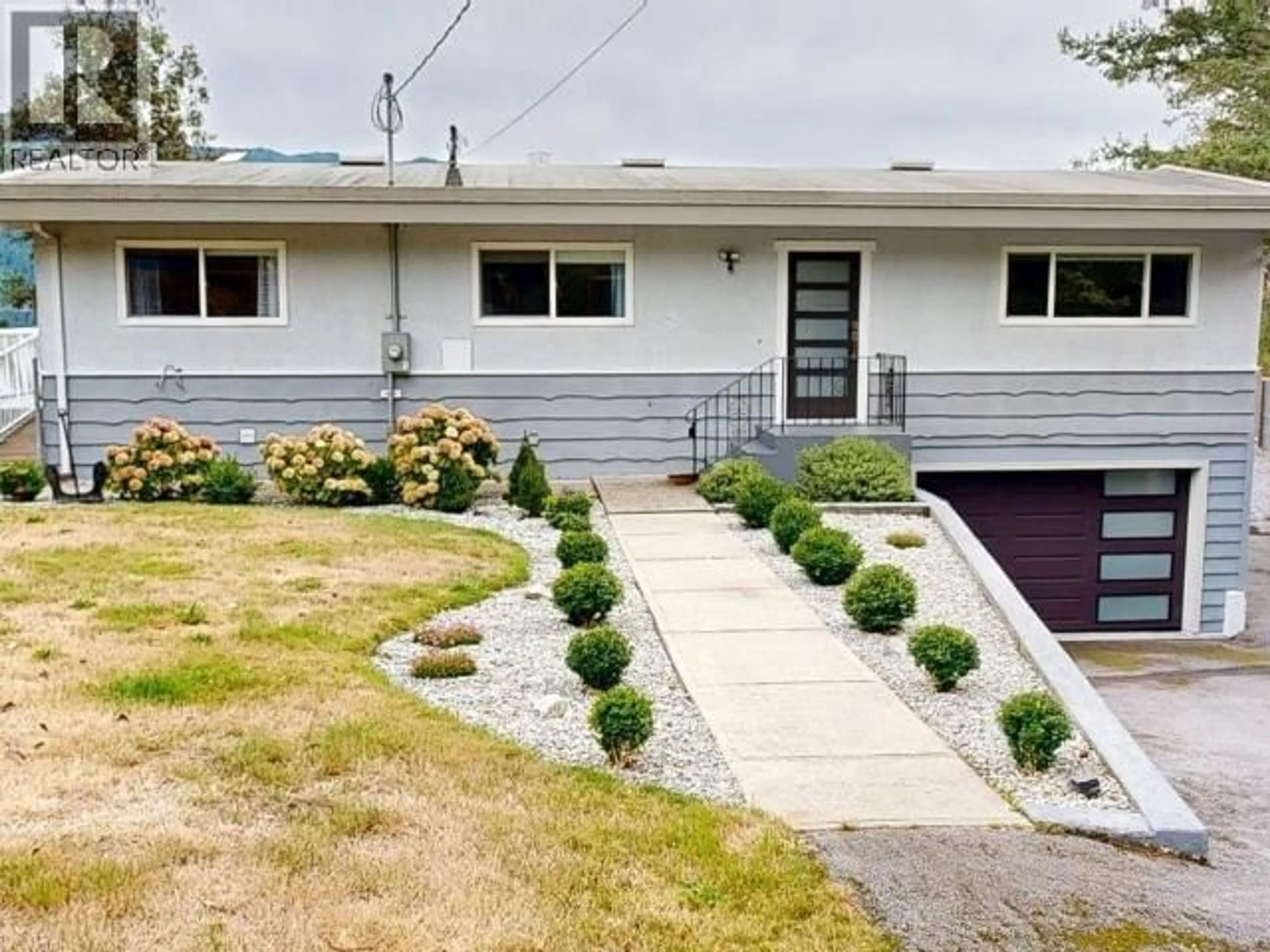 Home with vinyl exterior material, street for 2440 JENKINSON ROAD, Powell River British Columbia V8A0N2