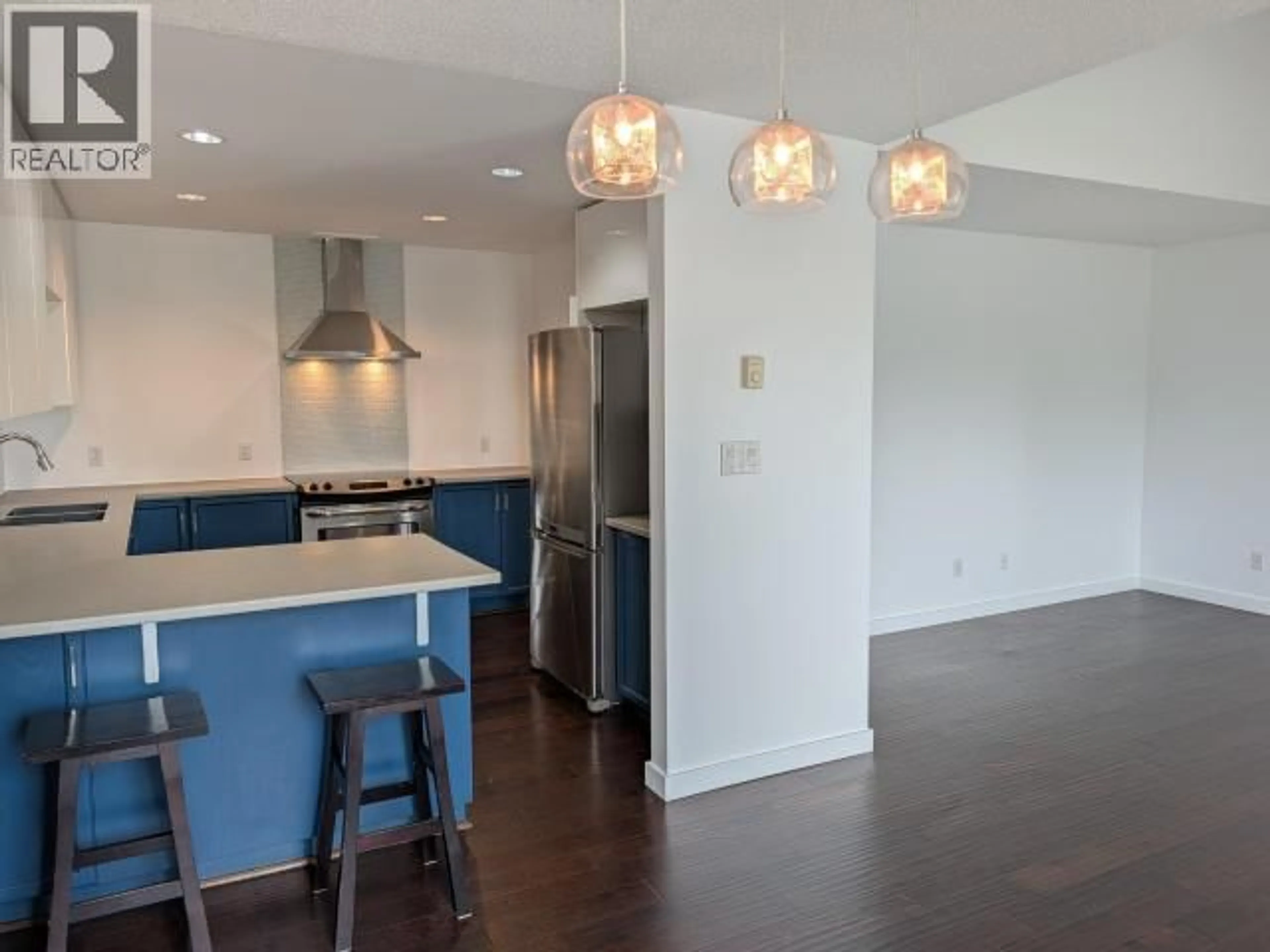 Open concept kitchen, wood/laminate floor for 305 - 4580 JOYCE AVE, Powell River British Columbia V8A3A9