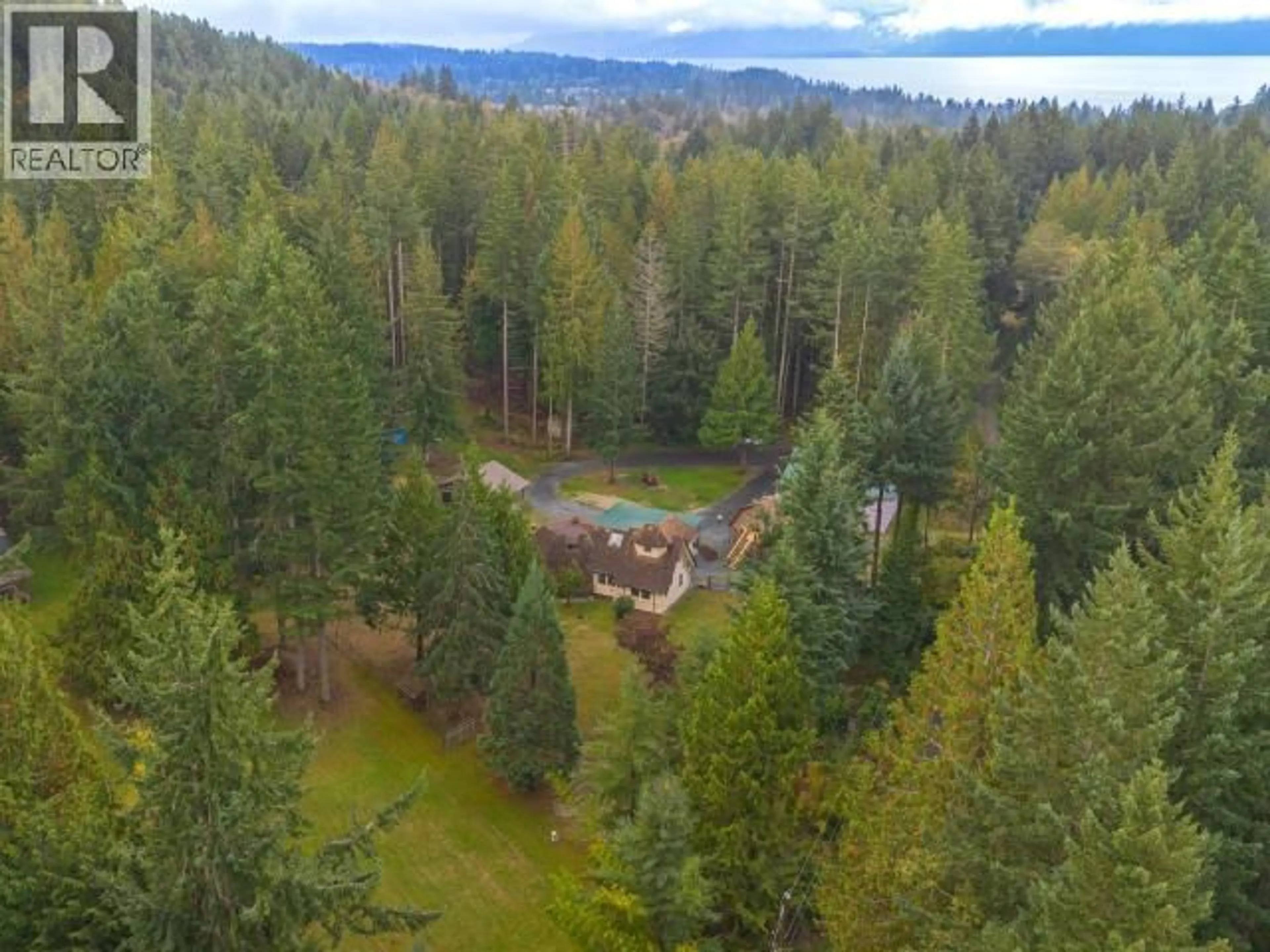 A pic from outside/outdoor area/front of a property/back of a property/a pic from drone, forest/trees view for 8089 DAISY ROAD, Powell River British Columbia V8A0S7