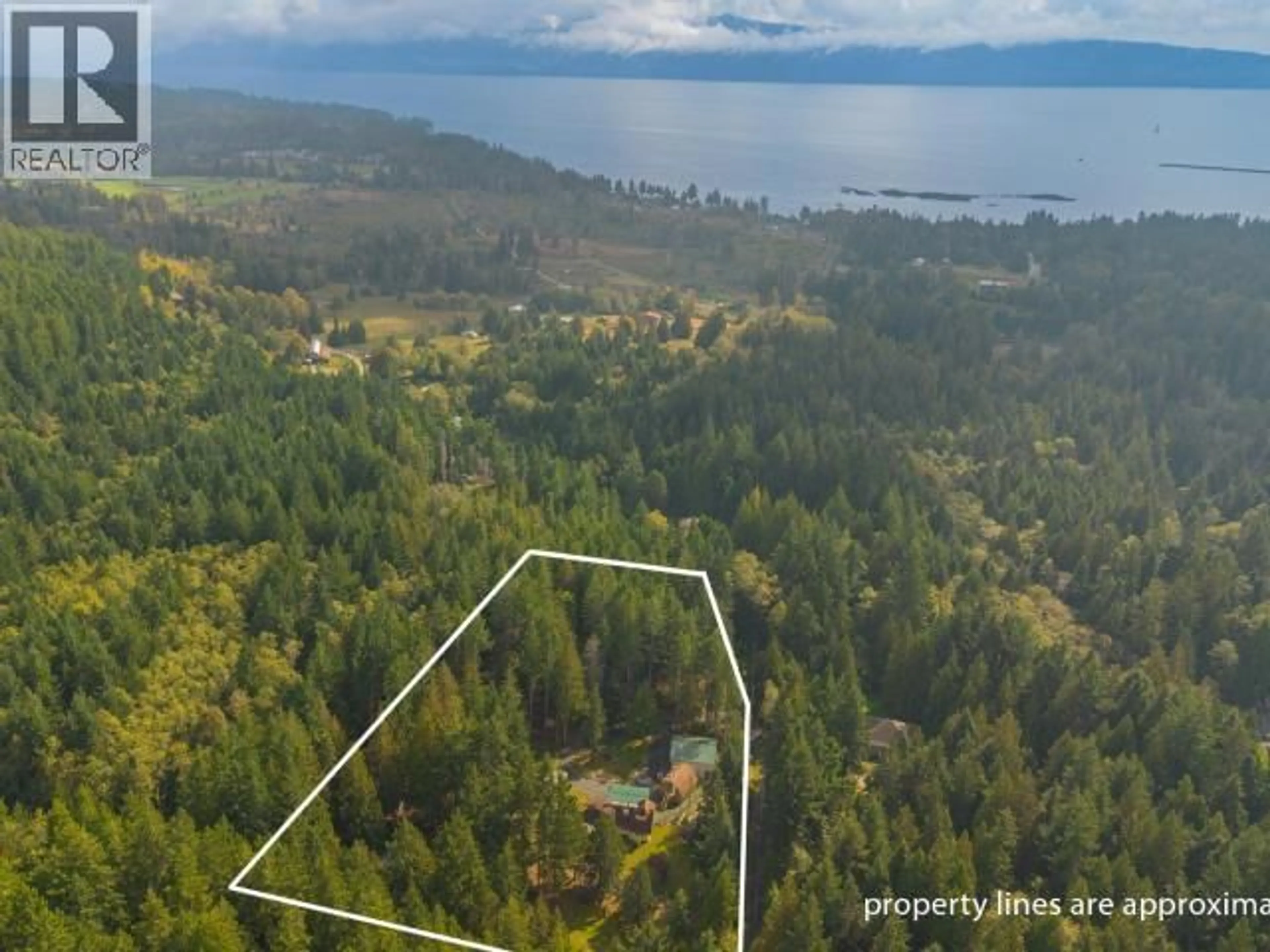 A pic from outside/outdoor area/front of a property/back of a property/a pic from drone, water/lake/river/ocean view for 8089 DAISY ROAD, Powell River British Columbia V8A0S7