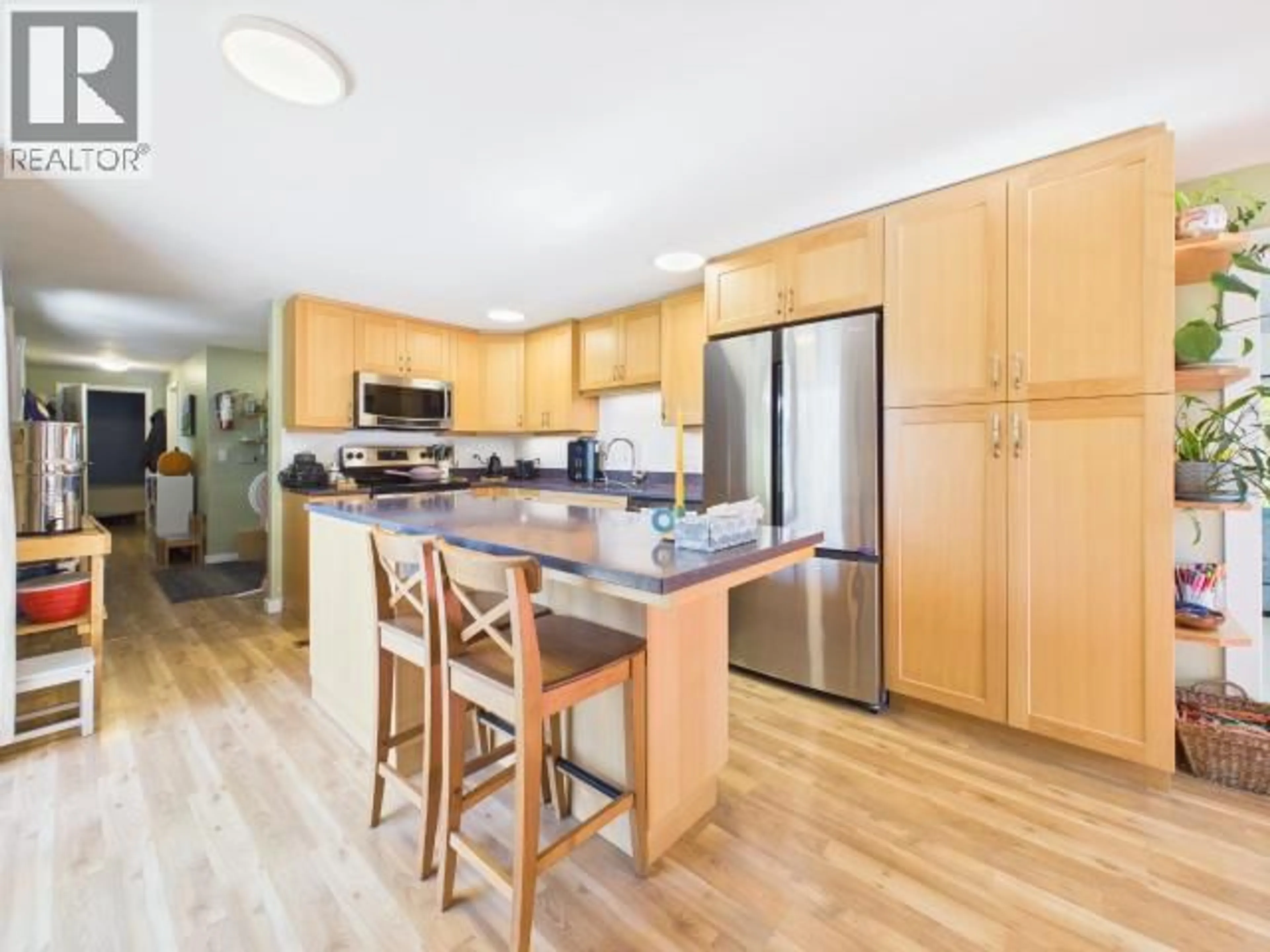 Open concept kitchen, wood/laminate floor for 8612 MYRTLE POINT ROAD, Powell River British Columbia V8A0H2