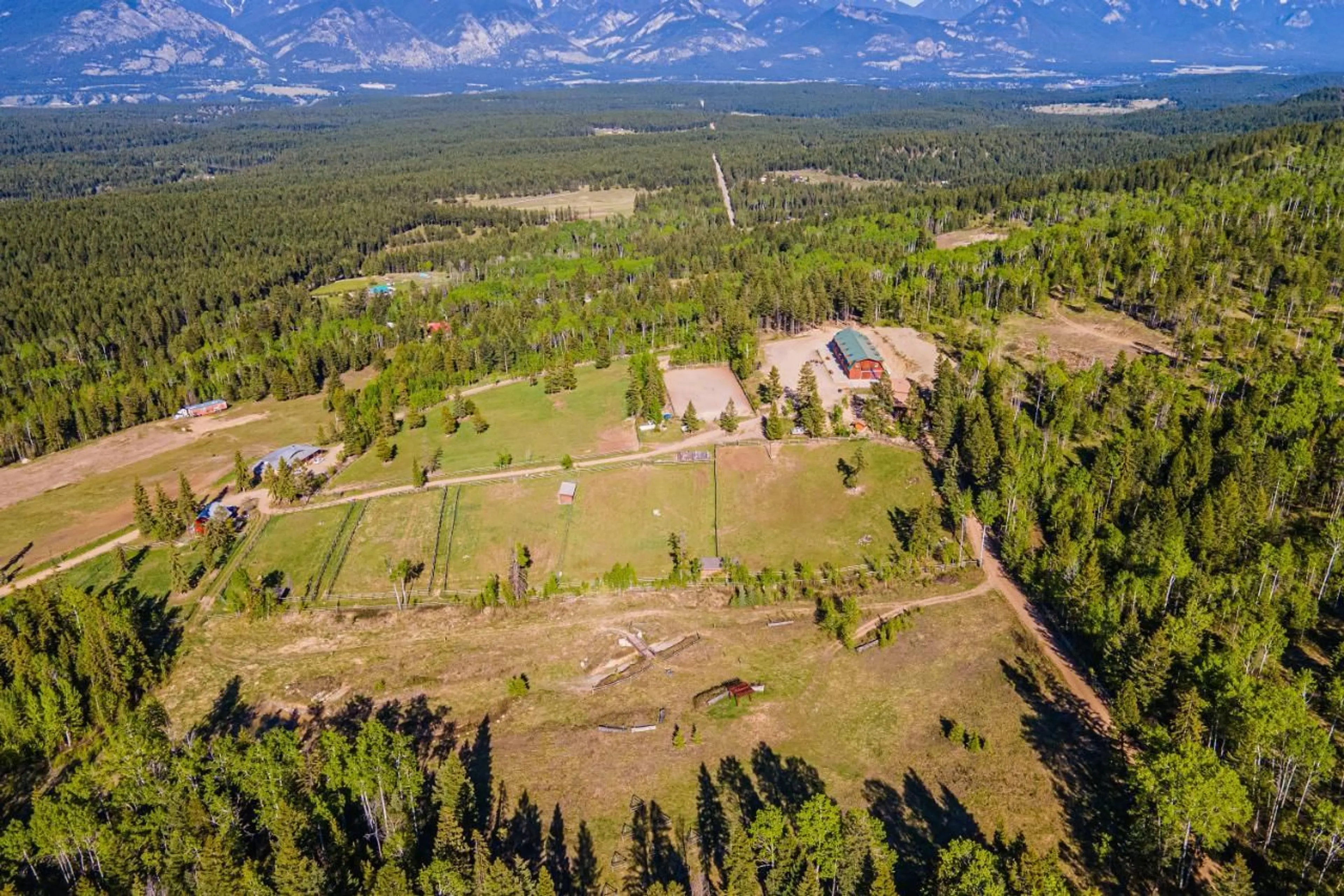 A pic from exterior of the house or condo, the fenced backyard for 3054 HOULGRAVE Road, Invermere British Columbia V0A1K5