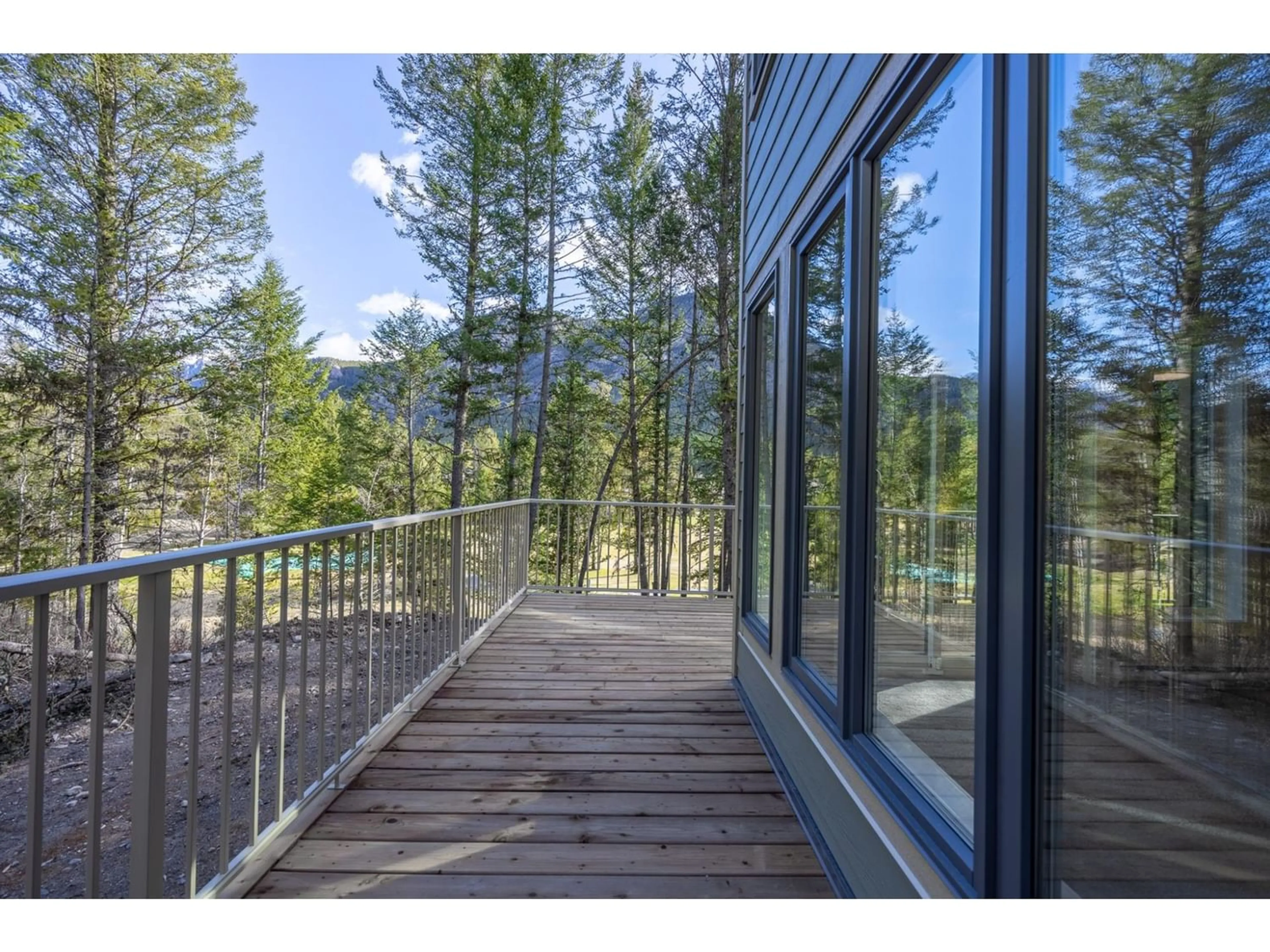 A pic from exterior of the house or condo, the fenced backyard for 7977 RADIUM GOLF COURSE Road Unit# 1, Radium Hot Springs British Columbia V0A1M0