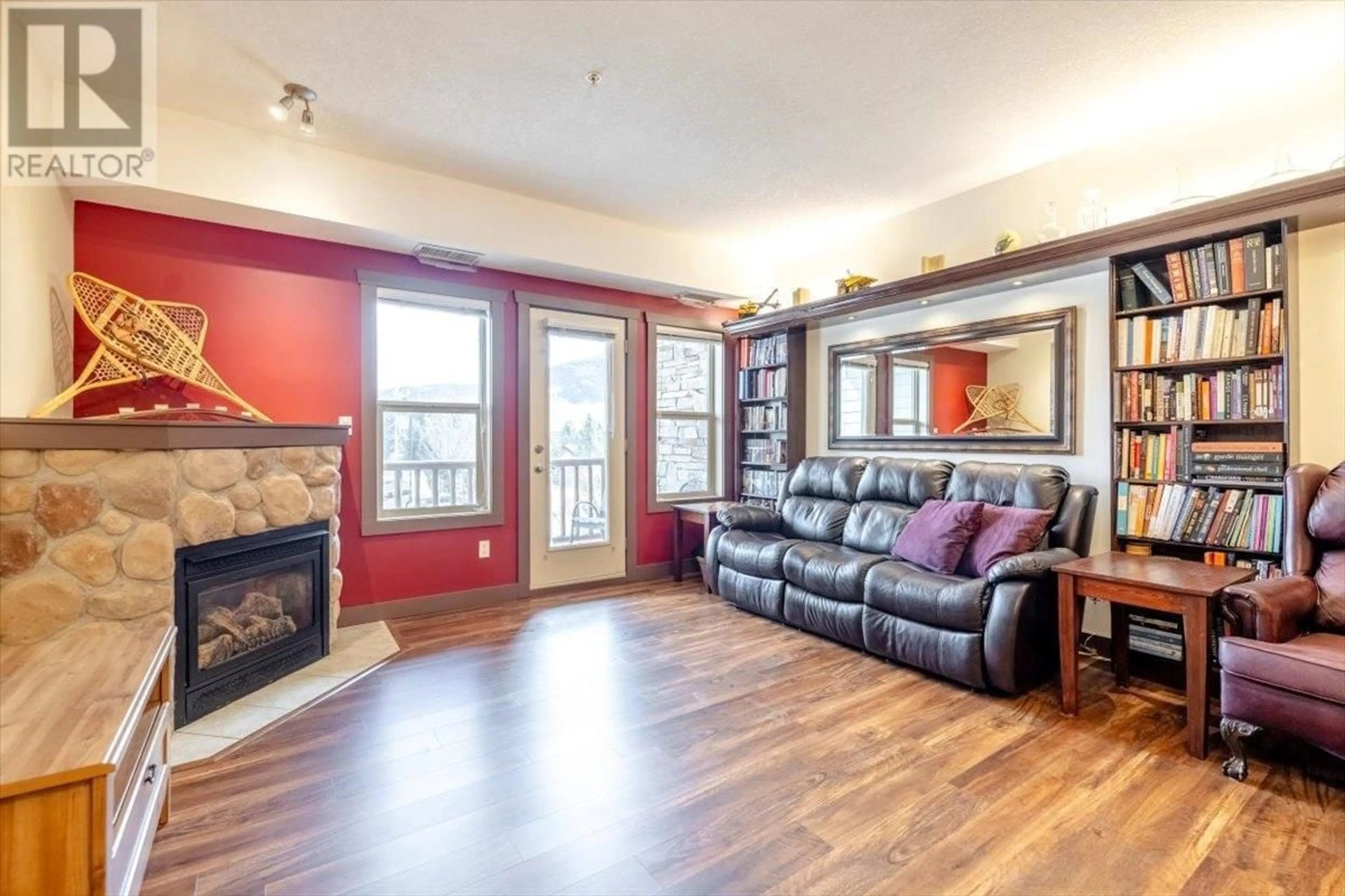 Living room with furniture, wood/laminate floor for 201 - 1500 MCDONALD AVENUE, Fernie British Columbia V0B1M1