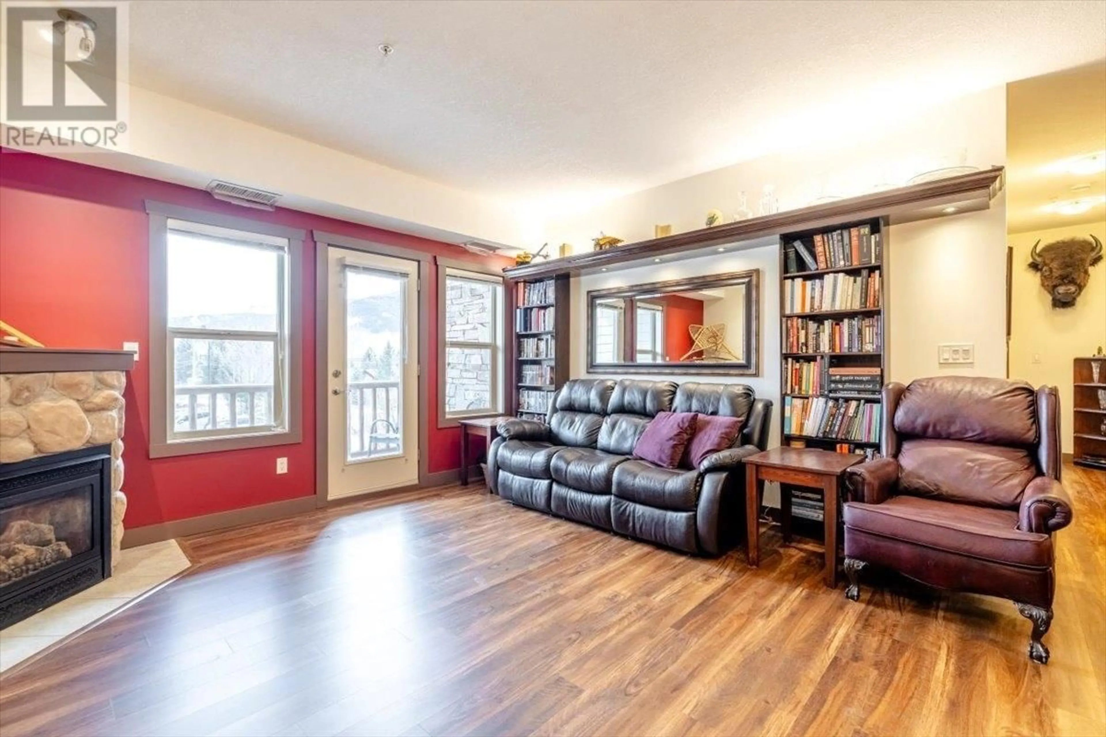 Living room with furniture, wood/laminate floor for 201 - 1500 MCDONALD AVENUE, Fernie British Columbia V0B1M1