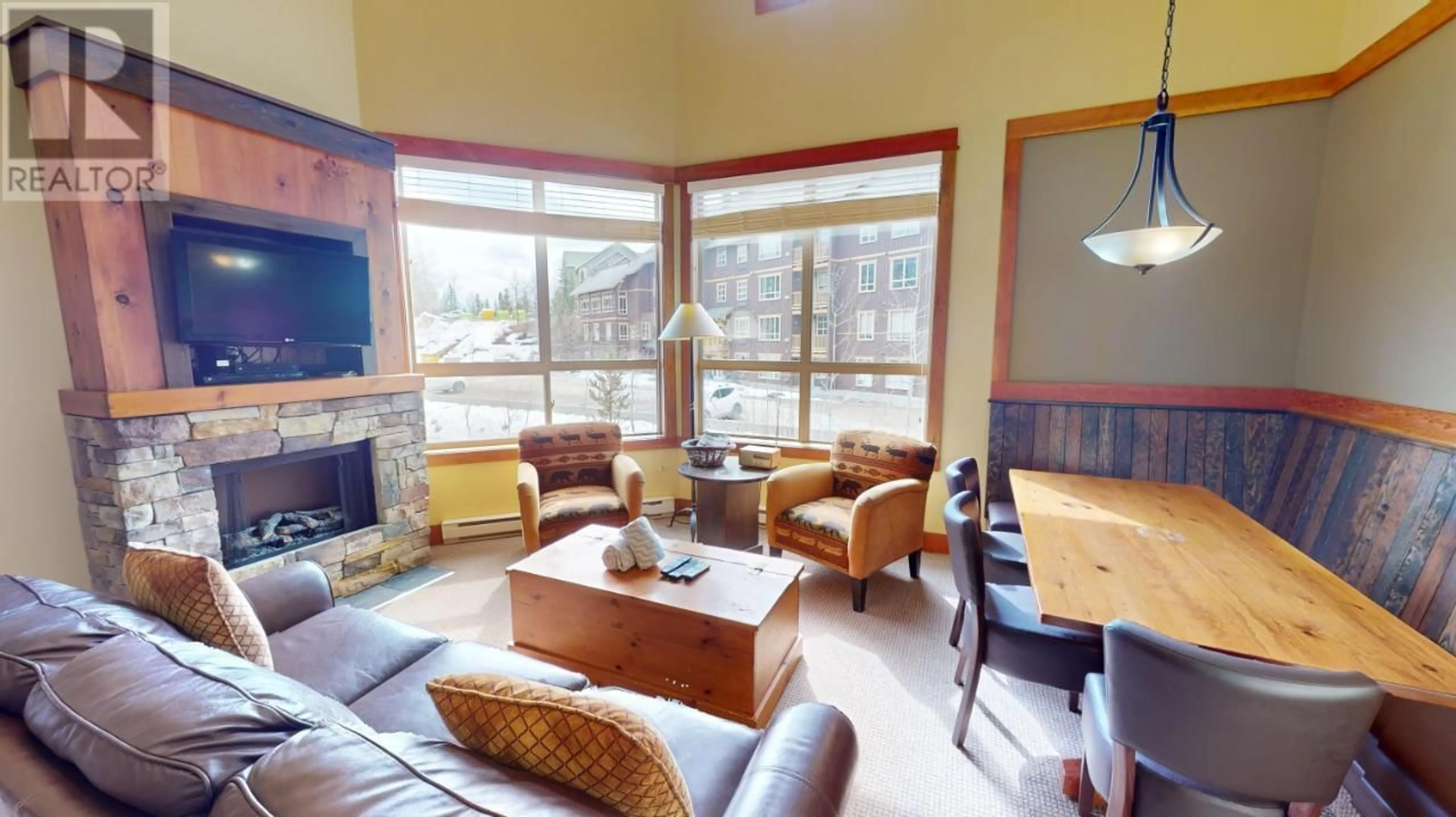Living room with furniture, wood/laminate floor for 643C - 4559 TIMBERLINE CRESCENT, Fernie British Columbia V0B1M6