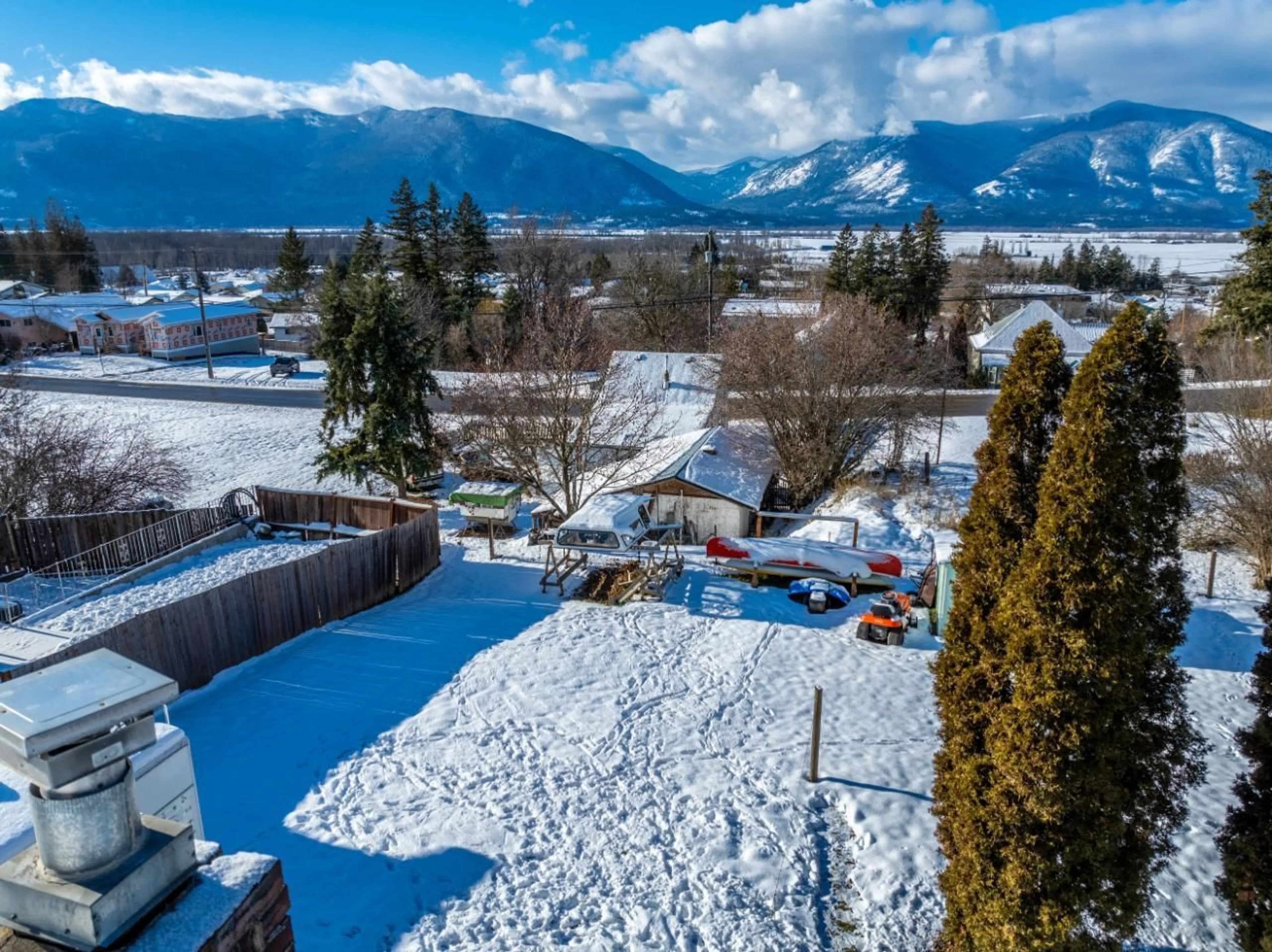 Frontside or backside of a home, the fenced backyard for 229 9TH  S Avenue, Creston British Columbia V0B1G3