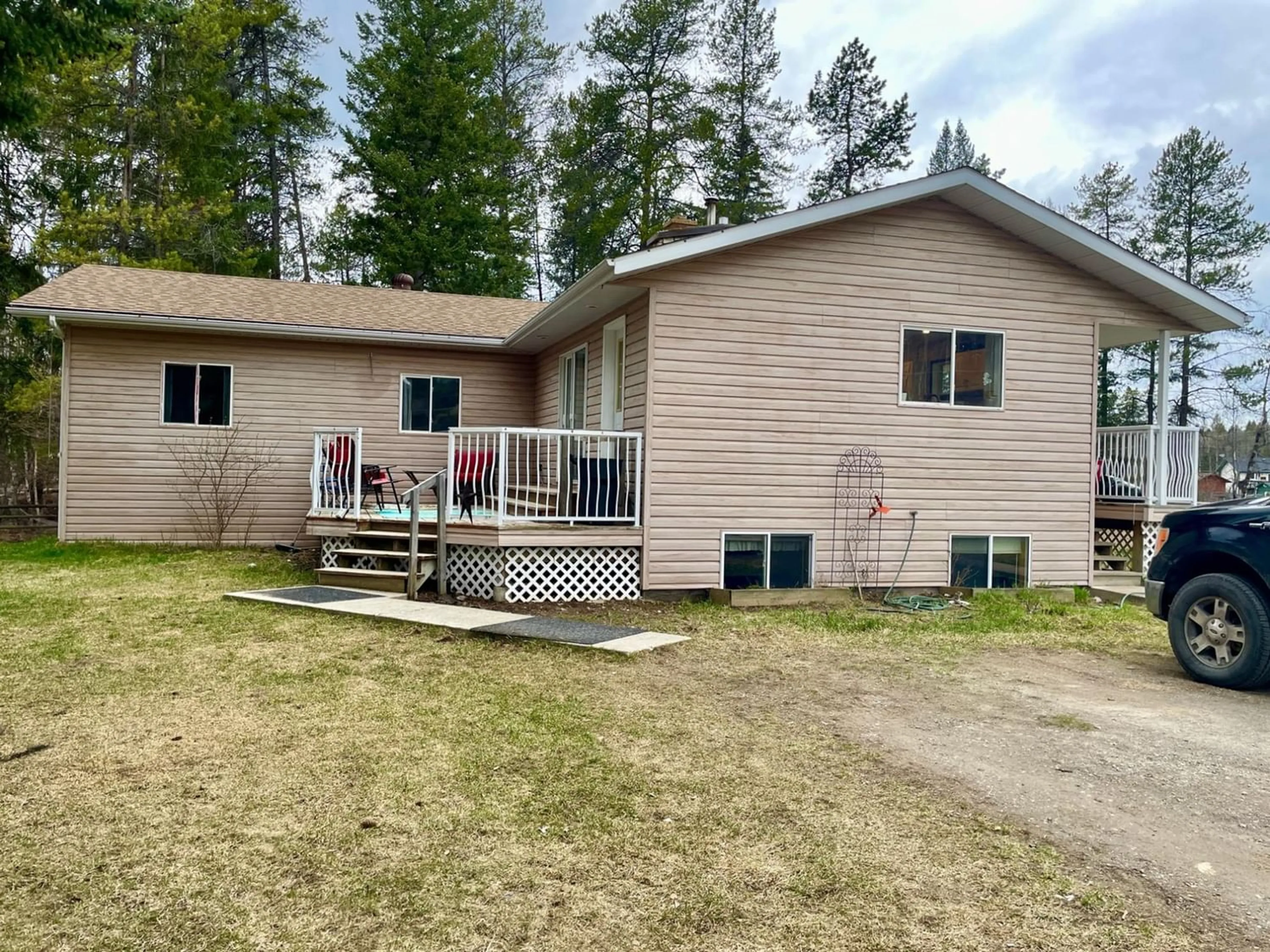 A pic from exterior of the house or condo, the fenced backyard for 2690 PEASLEY Road, Jaffray British Columbia V0B1T3