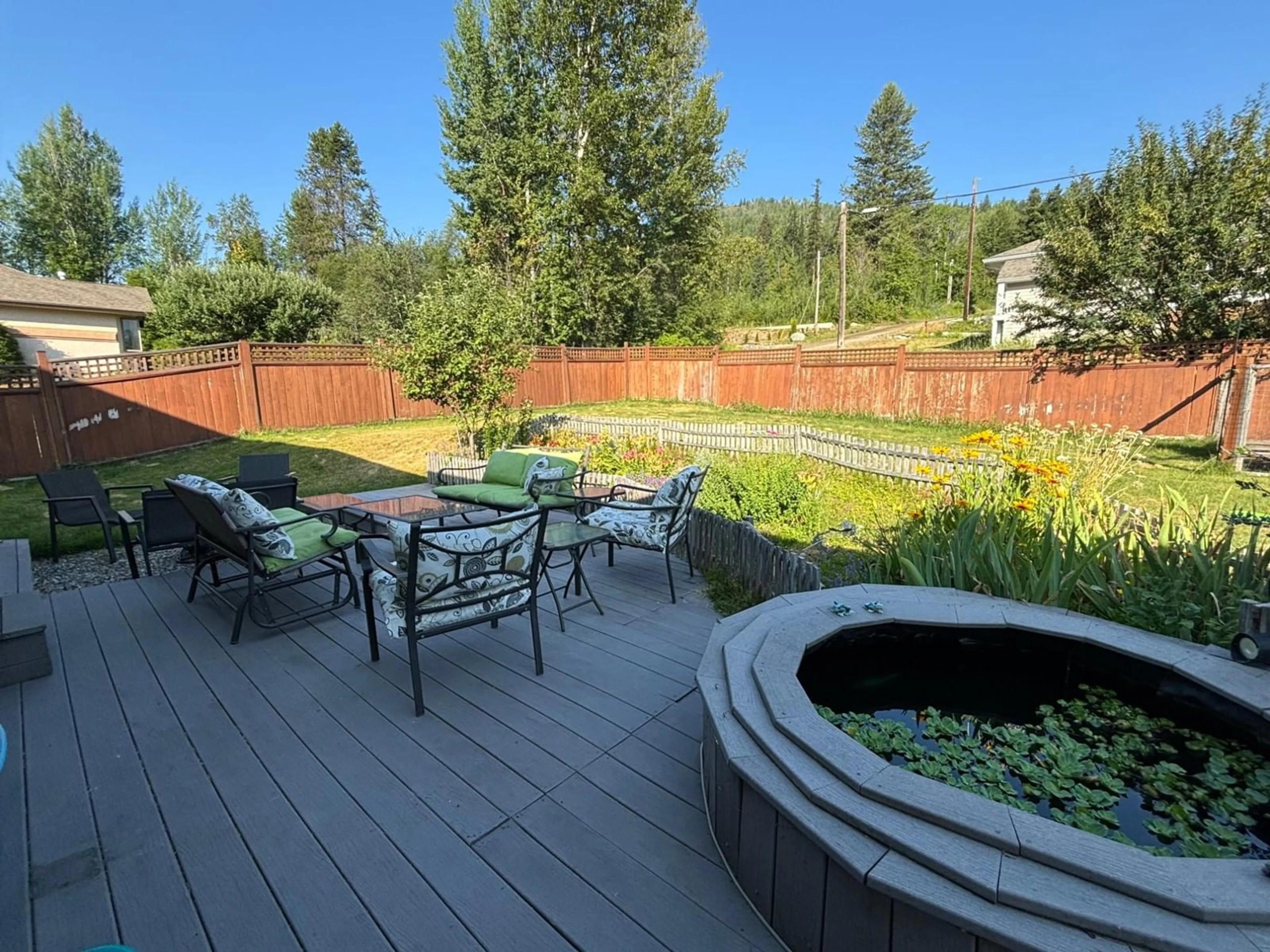 Patio, the fenced backyard for 1835 FIRST Street, Fruitvale British Columbia V0G1L0