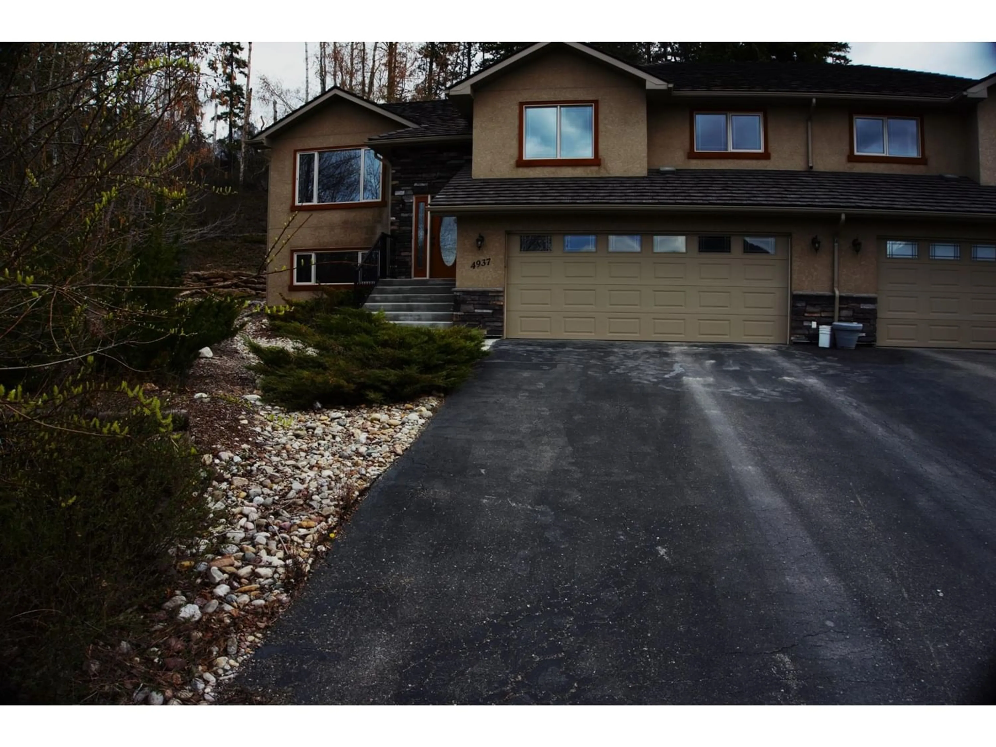 Frontside or backside of a home, the street view for 4937 ASPEN GROVE Place, Fairmont Hot Springs British Columbia V0B1L1