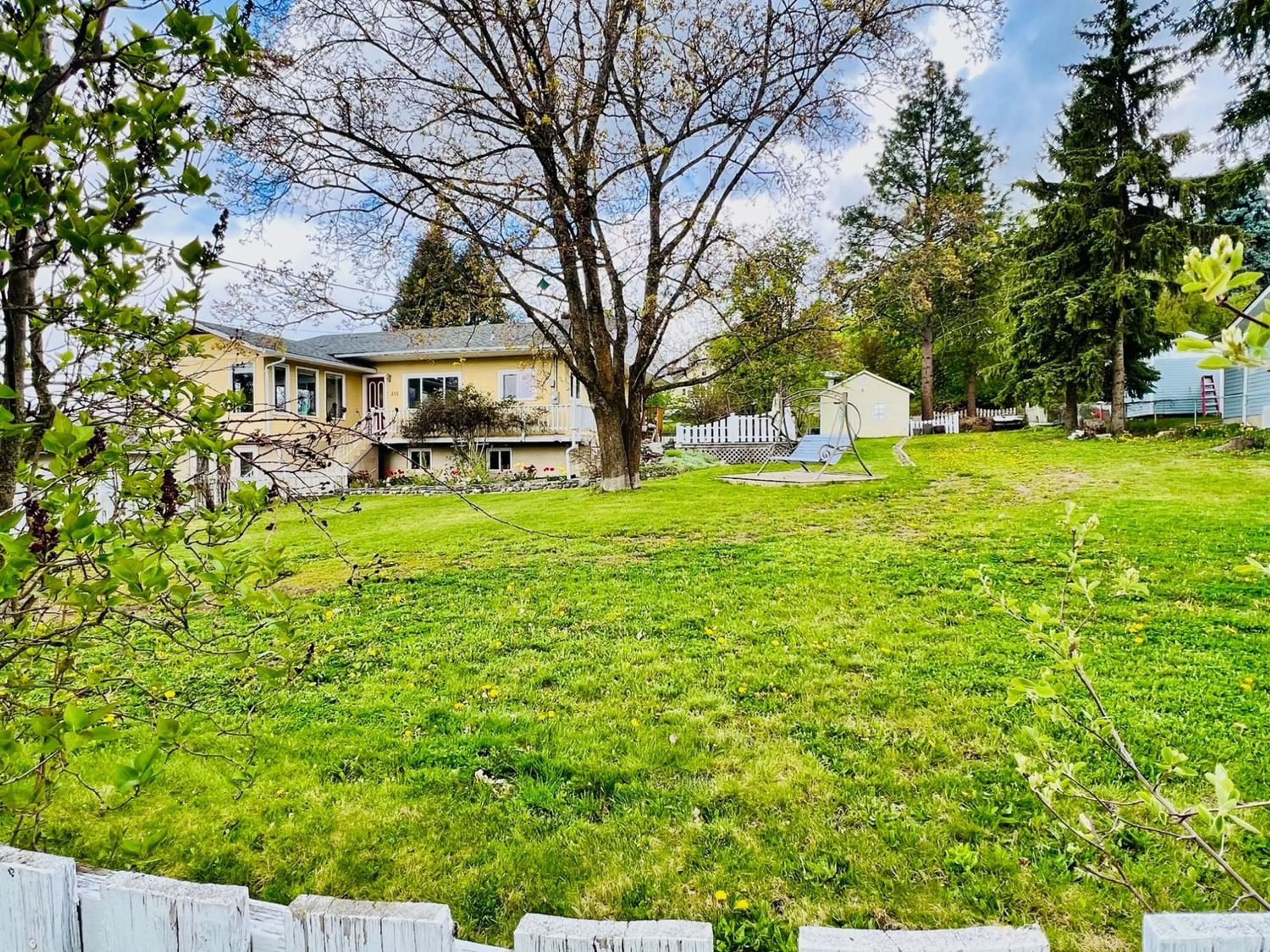 Frontside or backside of a home, the fenced backyard for 210 21ST  S Avenue, Creston British Columbia V0B1G5