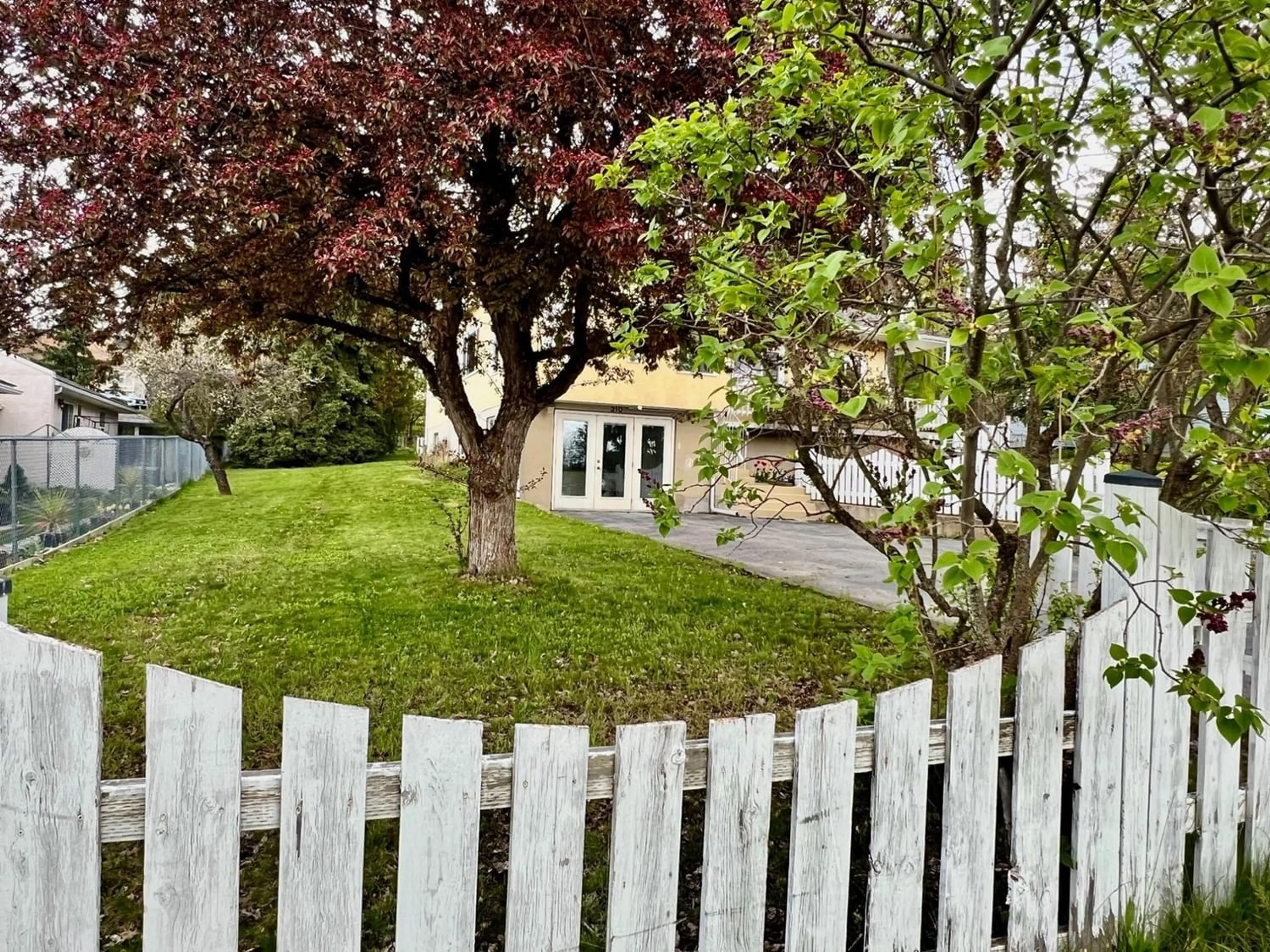 Frontside or backside of a home, the fenced backyard for 210 21ST  S Avenue, Creston British Columbia V0B1G5