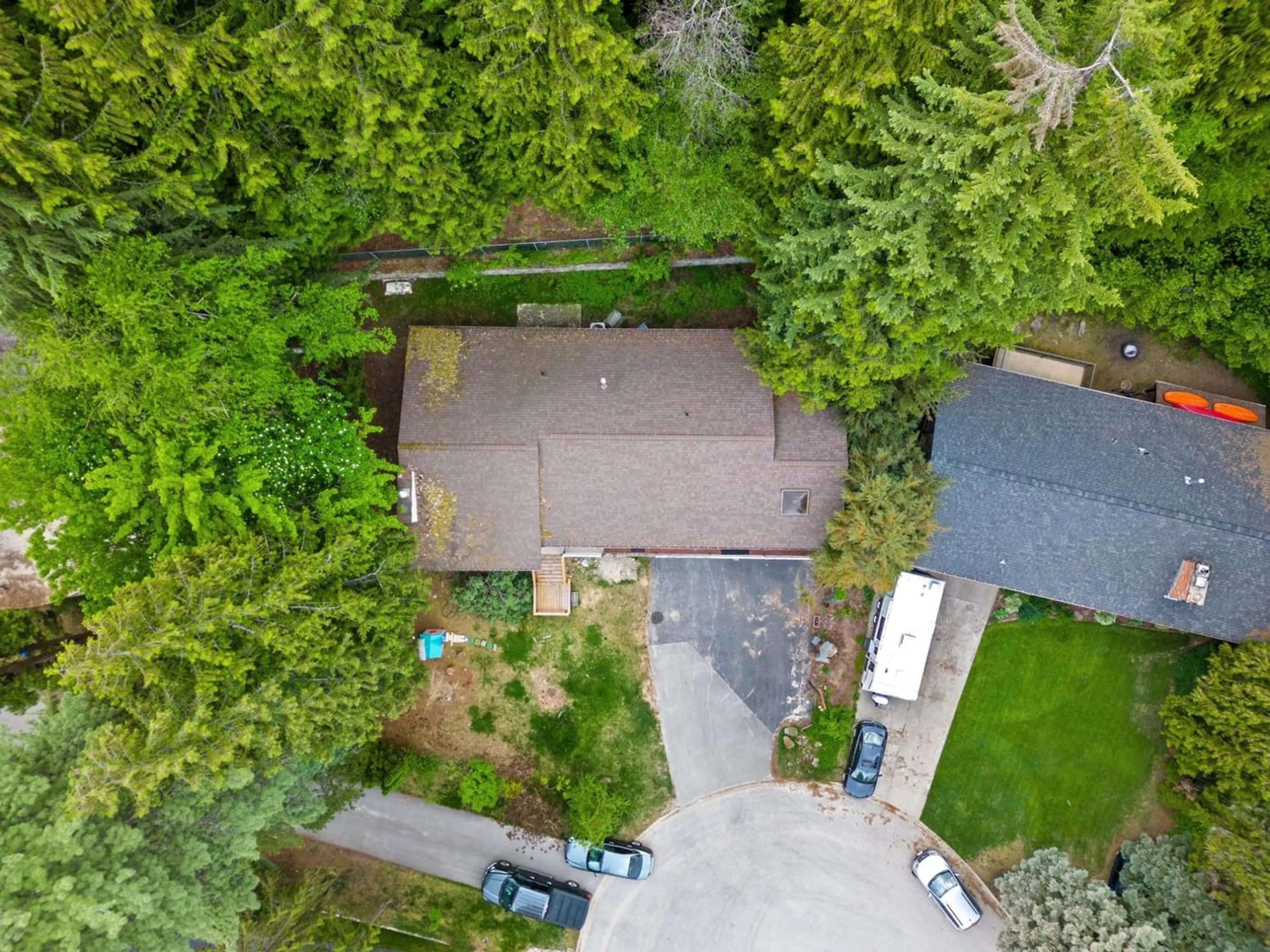 Frontside or backside of a home, the fenced backyard for 2428 12TH Avenue, Castlegar British Columbia V1N4A8