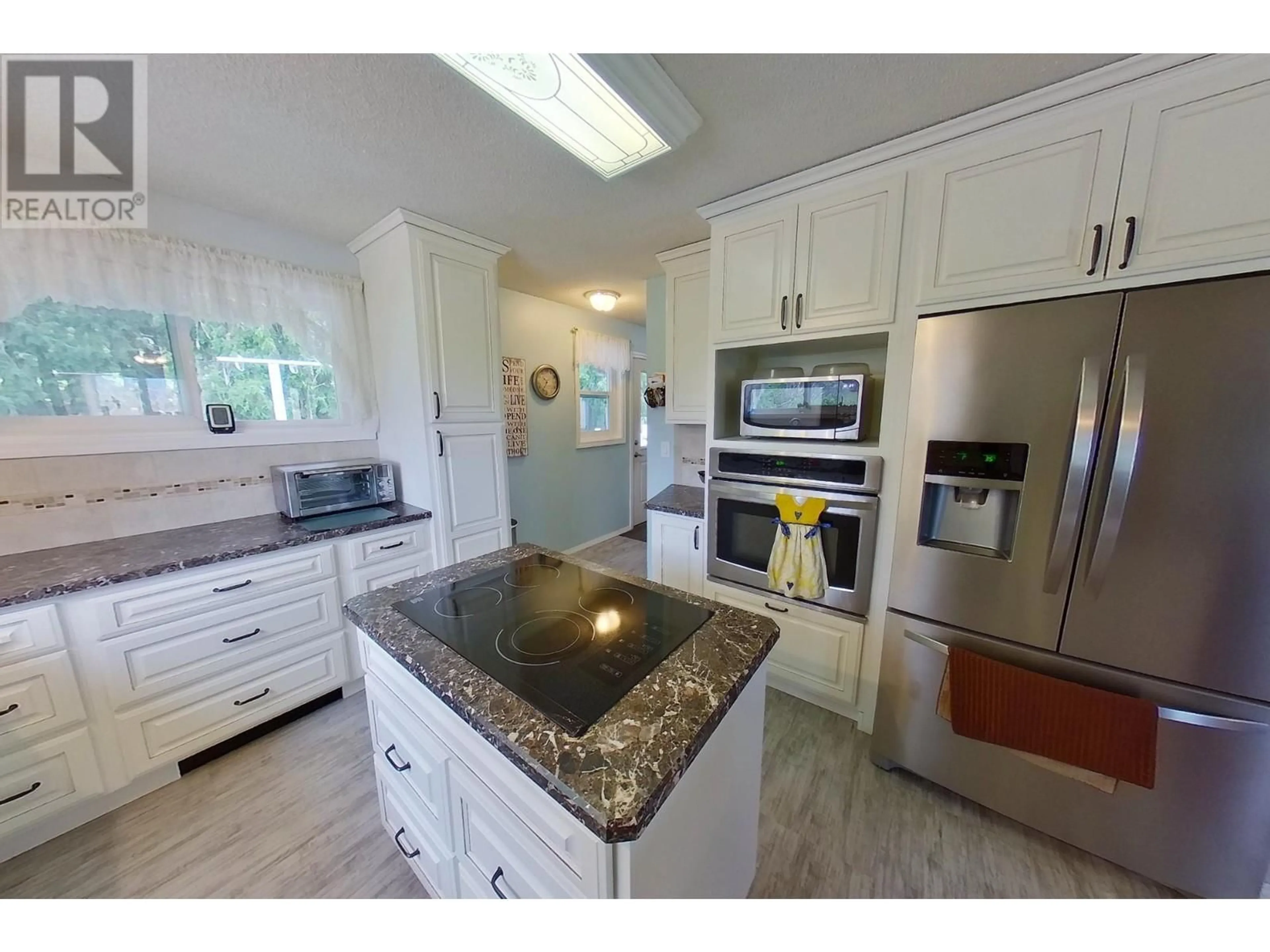 Open concept kitchen, ceramic/tile floor for 3635 PHILLIPS ROAD, Creston British Columbia V0B1G2