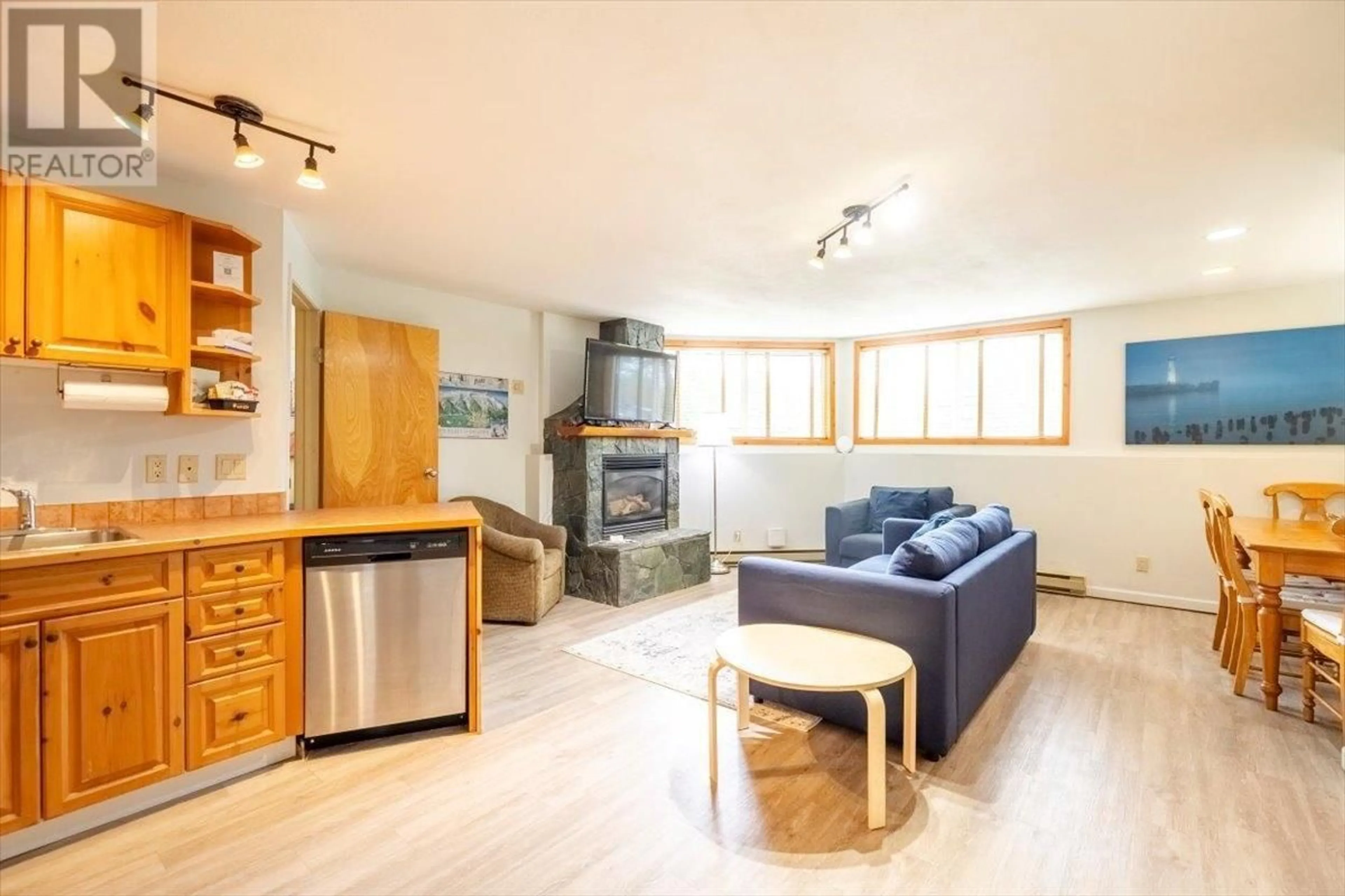 Living room with furniture, wood/laminate floor for 300 - 4559 TIMBERLINE CRESCENT, Fernie British Columbia V0B1M6