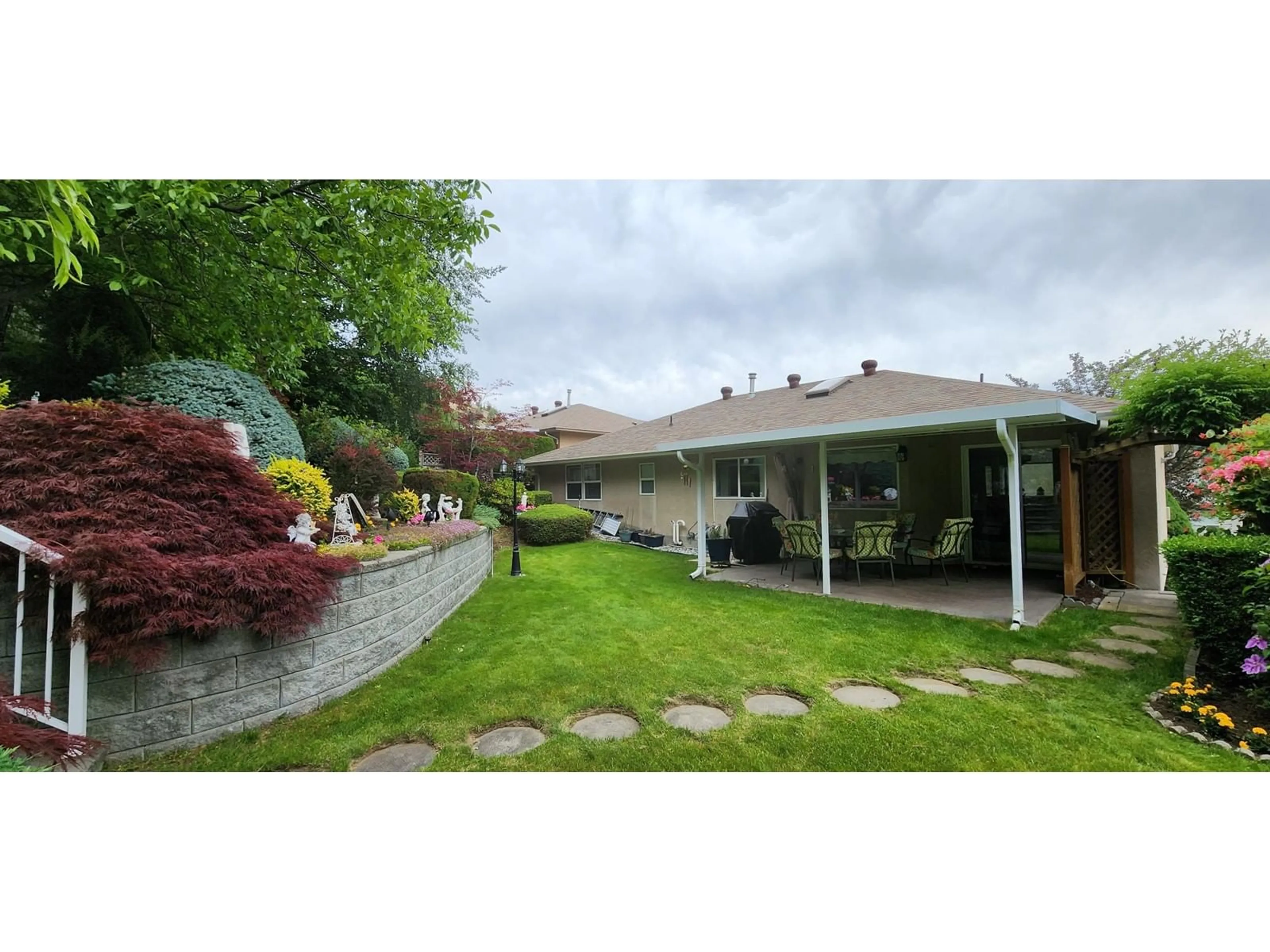 Patio, the fenced backyard for 7501 DEVITO Drive, Trail British Columbia V1R2Y8