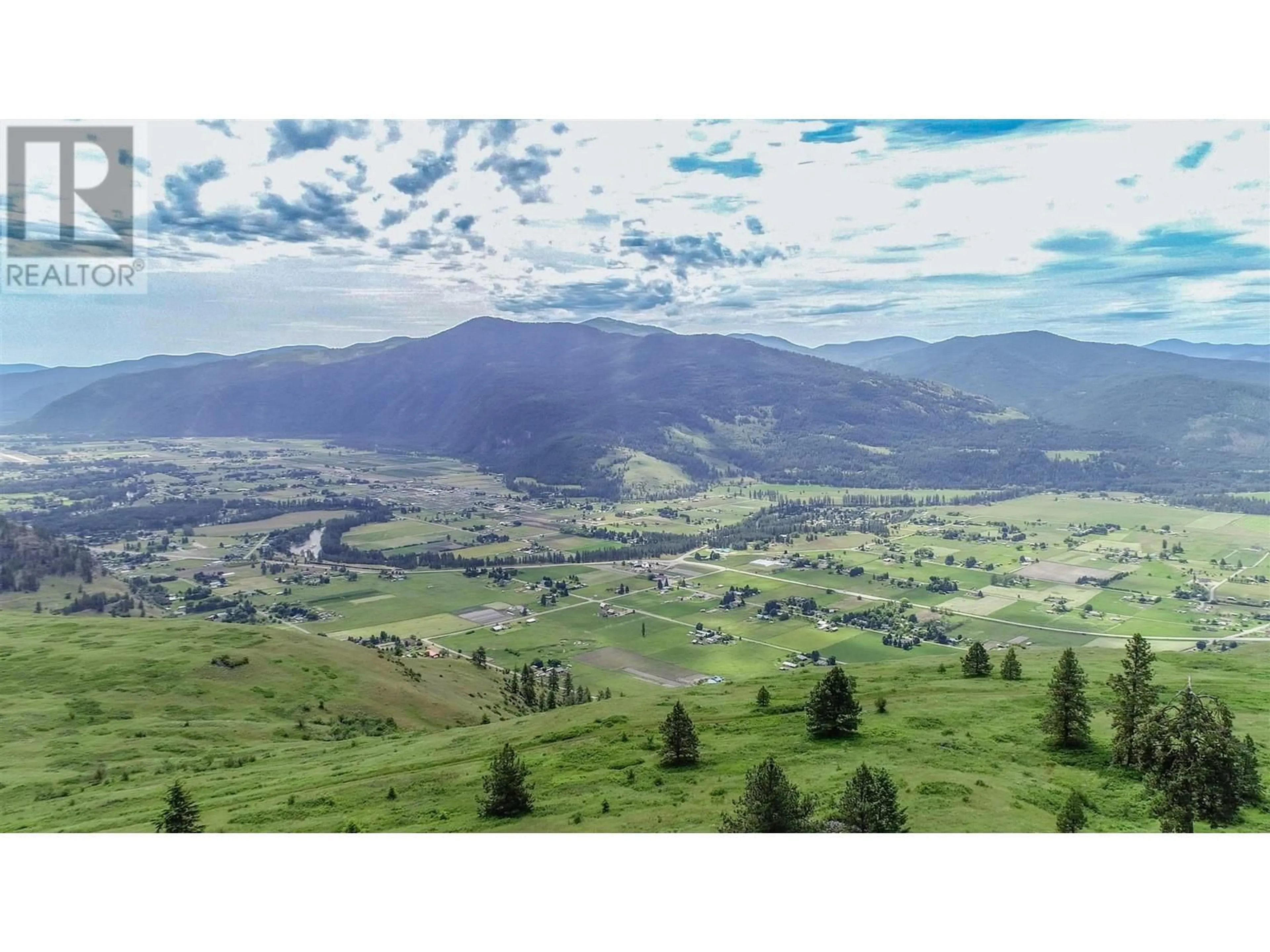 A pic from outside/outdoor area/front of a property/back of a property/a pic from drone, mountain view for 6700 DANSHIN VILLAGE ROAD, Grand Forks British Columbia V0H1H5
