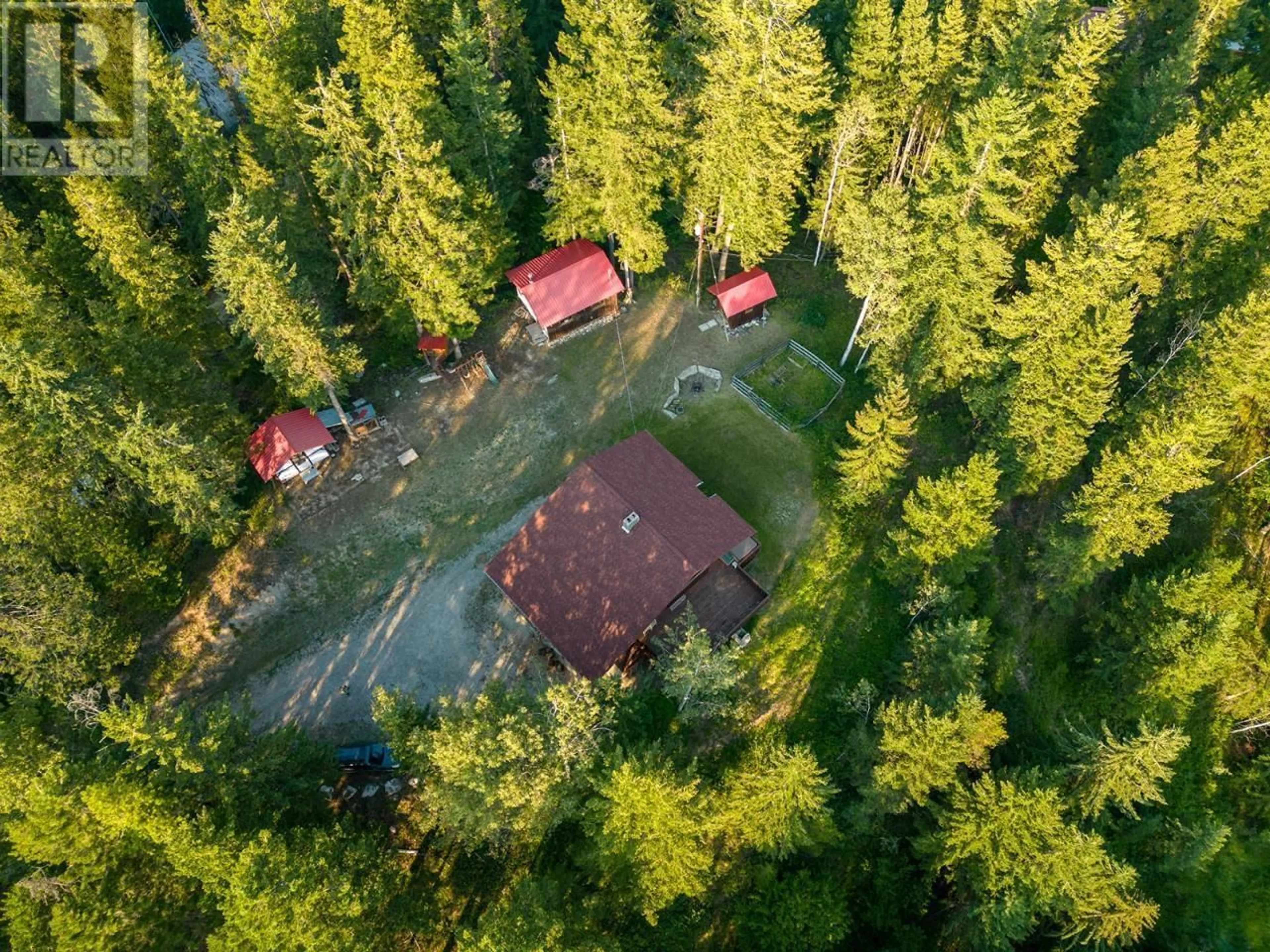 A pic from outside/outdoor area/front of a property/back of a property/a pic from drone, forest/trees view for 993 OSTER ROAD, Golden British Columbia V0A1H1