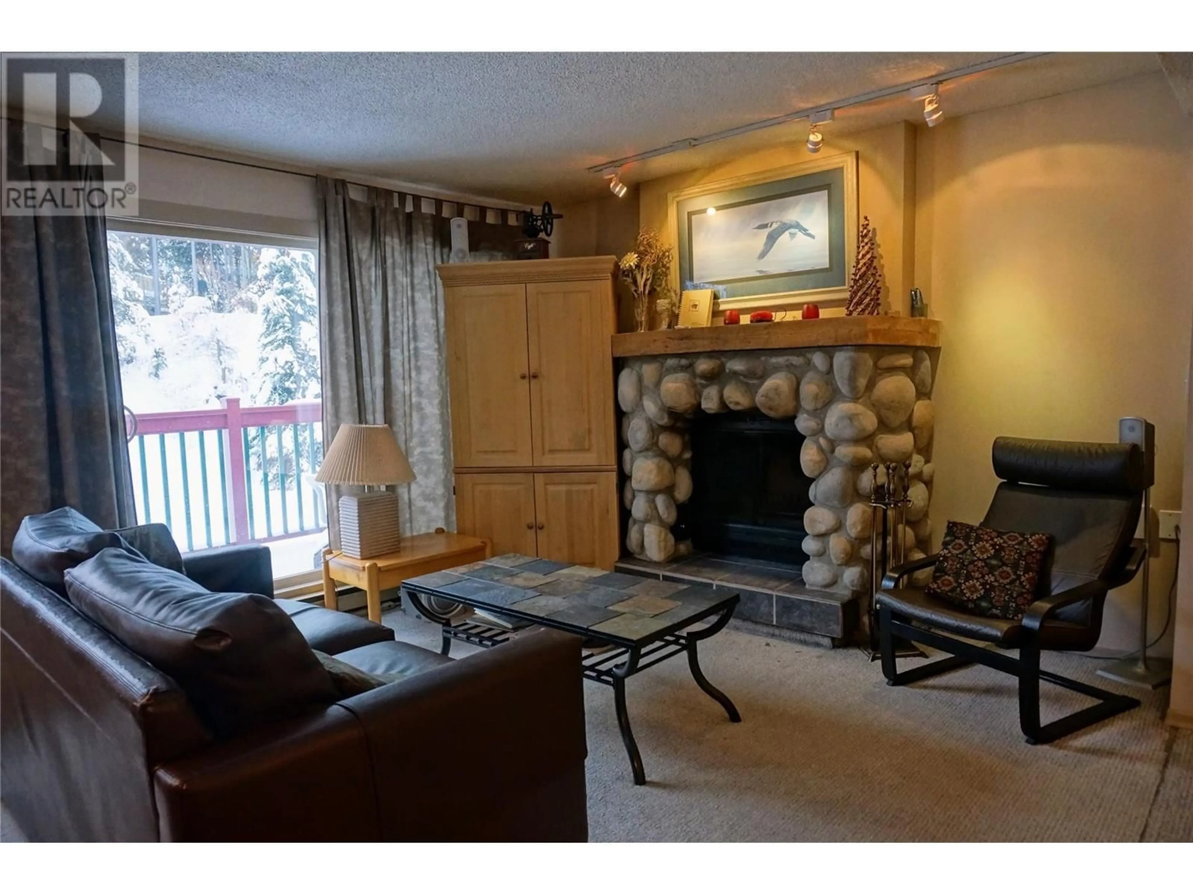 Living room with furniture, wood/laminate floor for 1007 - 2030 PANORAMA DRIVE, Panorama British Columbia V0A1T0