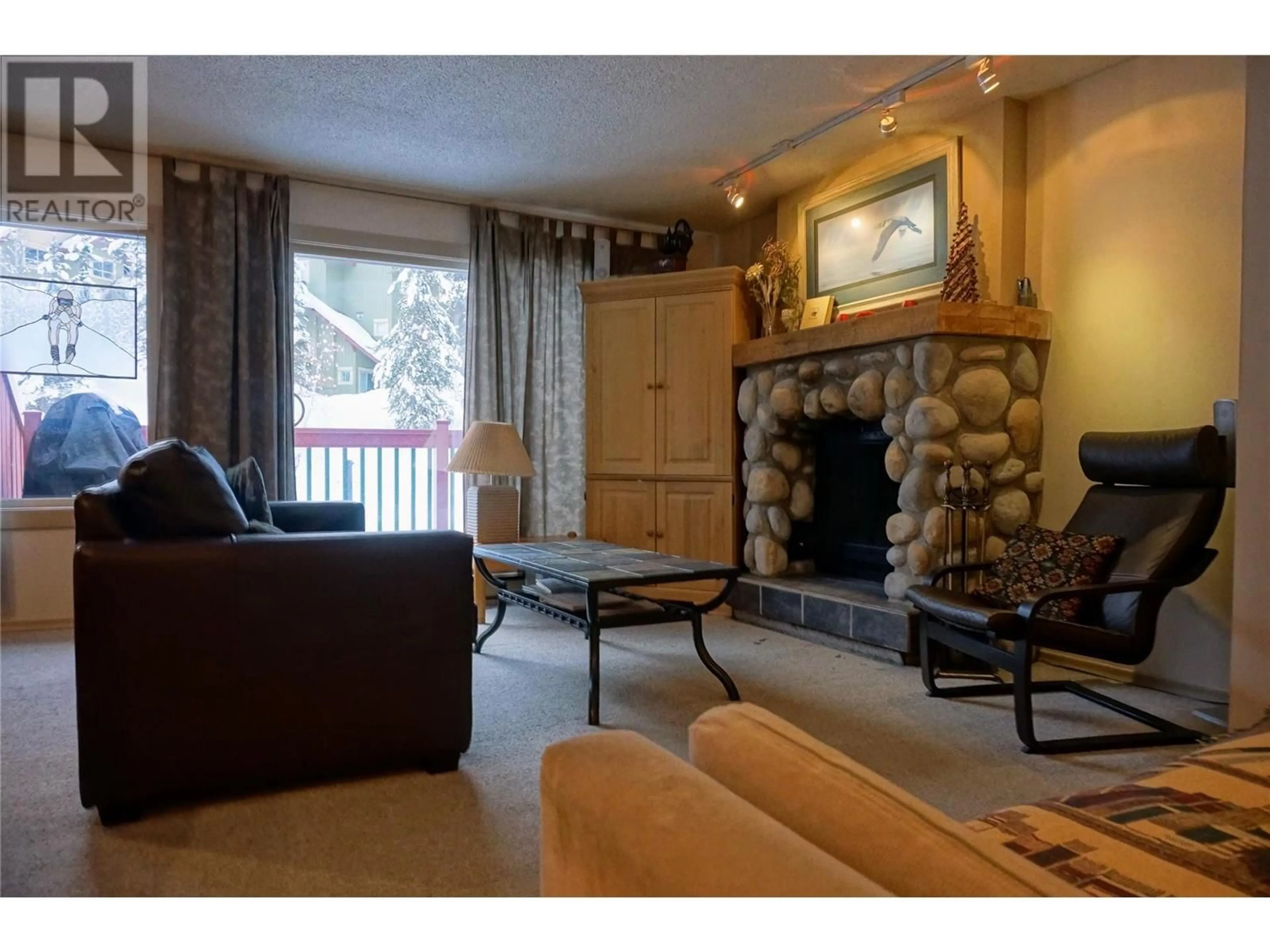 Living room with furniture, wood/laminate floor for 1007 - 2030 PANORAMA DRIVE, Panorama British Columbia V0A1T0