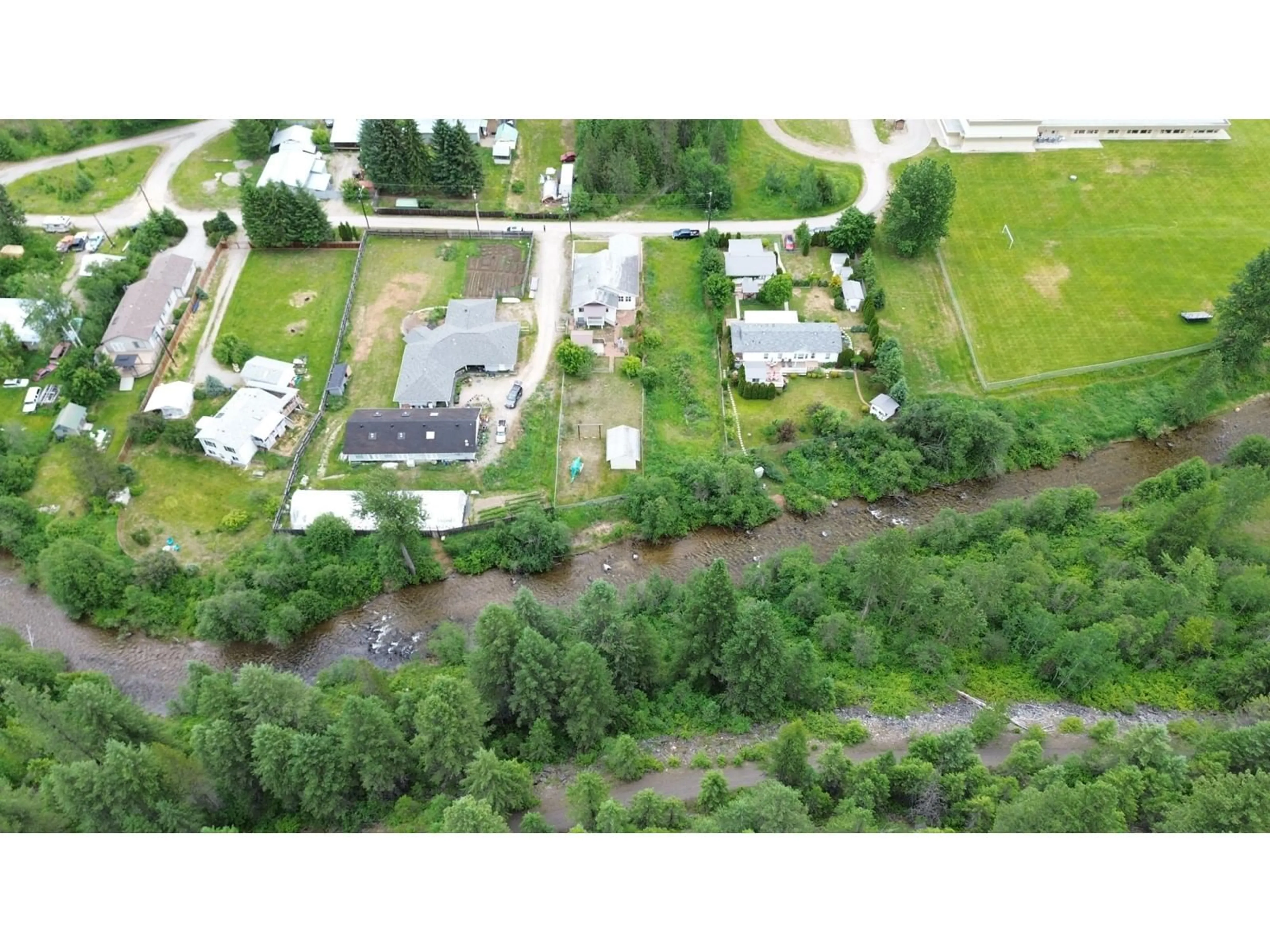 A pic from exterior of the house or condo, the fenced backyard for 826 BOUNDARY CREEK Lane, Greenwood British Columbia V0H1J0