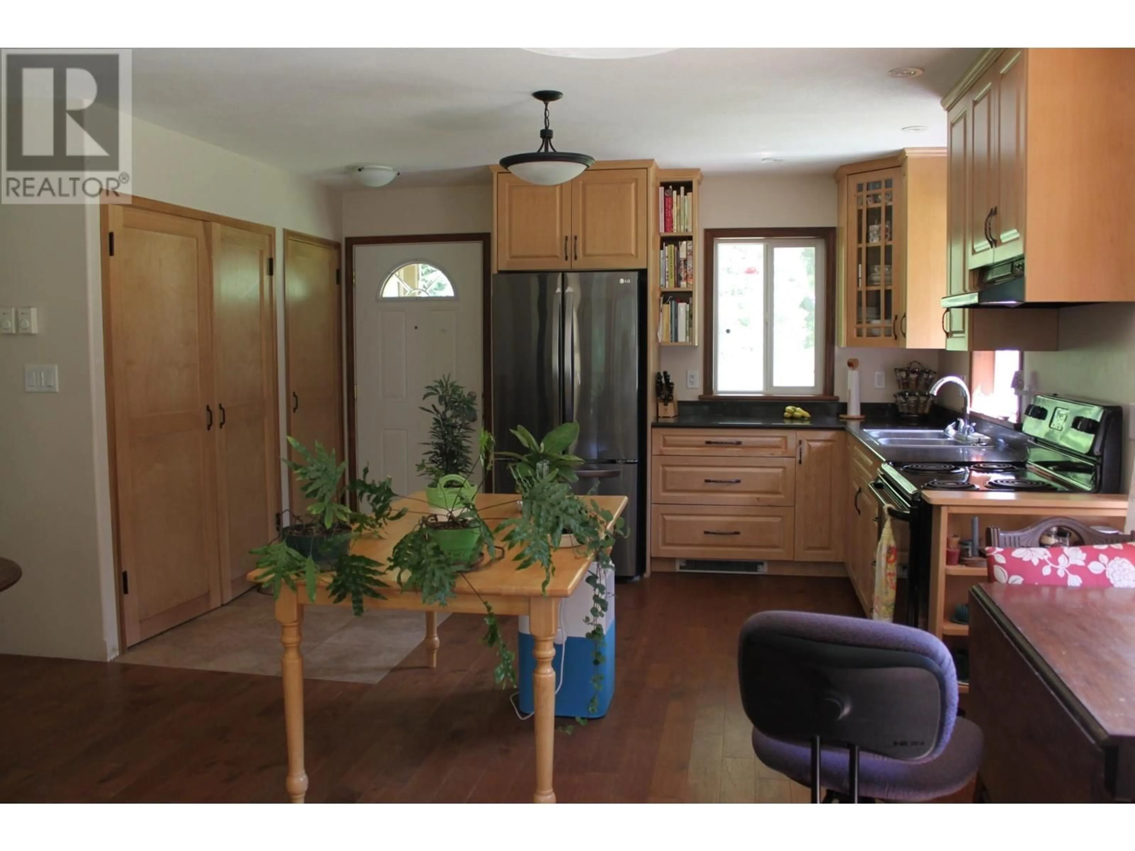 Open concept kitchen, wood/laminate floor for 4515 6 HIGHWAY, Hills British Columbia V0G1S1